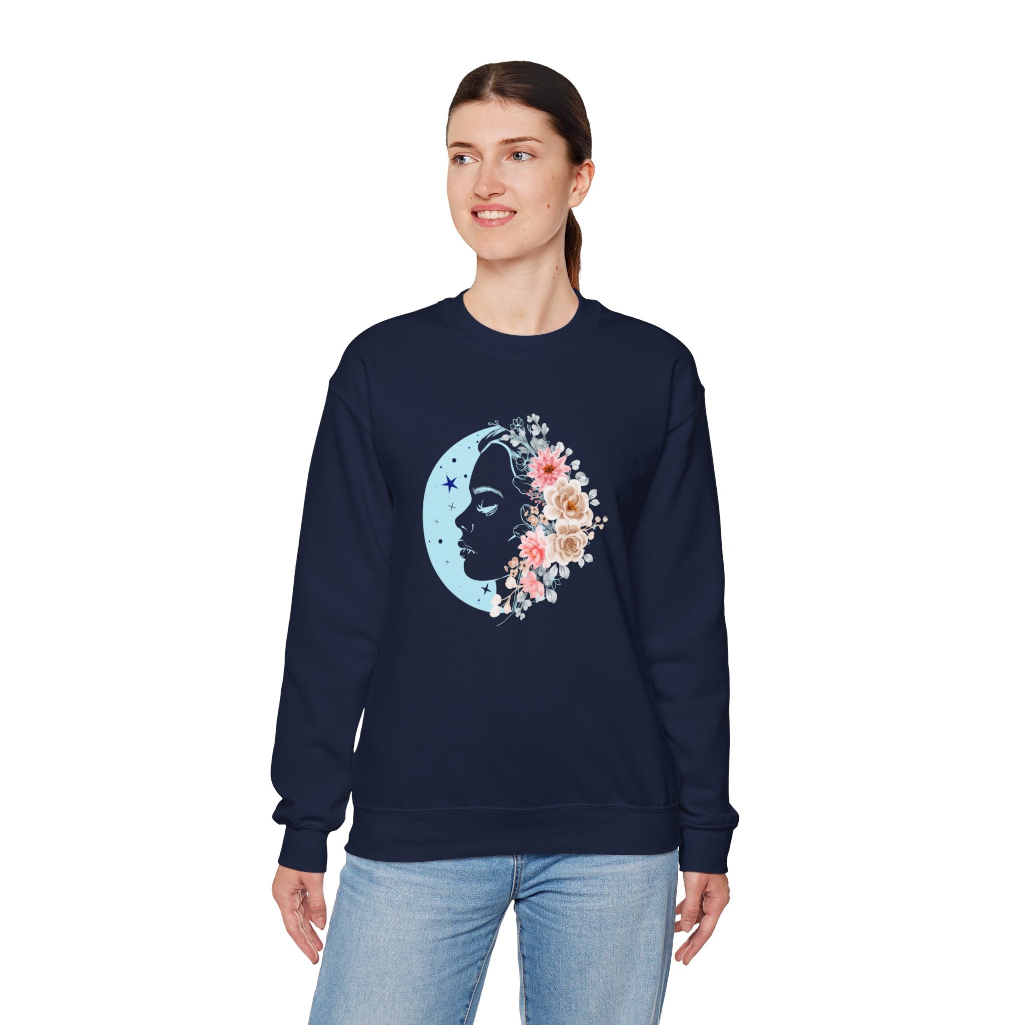 Woman wearing a navy sweatshirt with a floral moon design on a white background