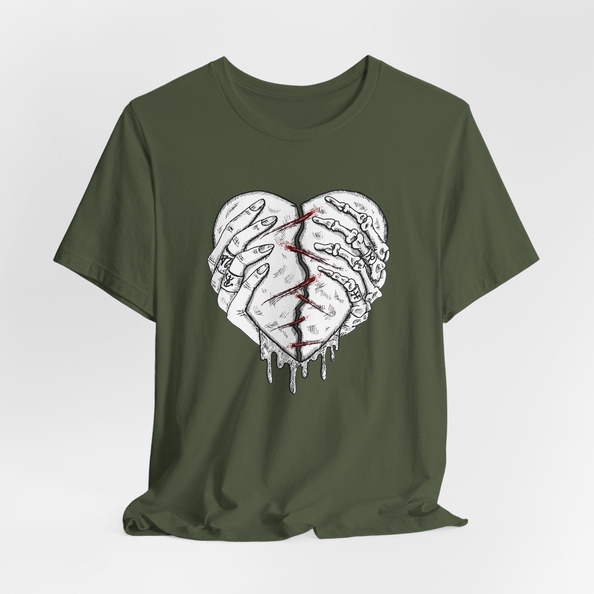 Green t-shirt with a graphic design of two hands holding a heart on a white background