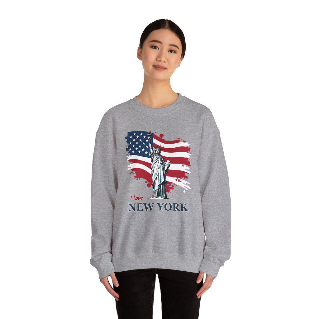 Person wearing a gray sweatshirt with Statue of Liberty and American flag design on a white background