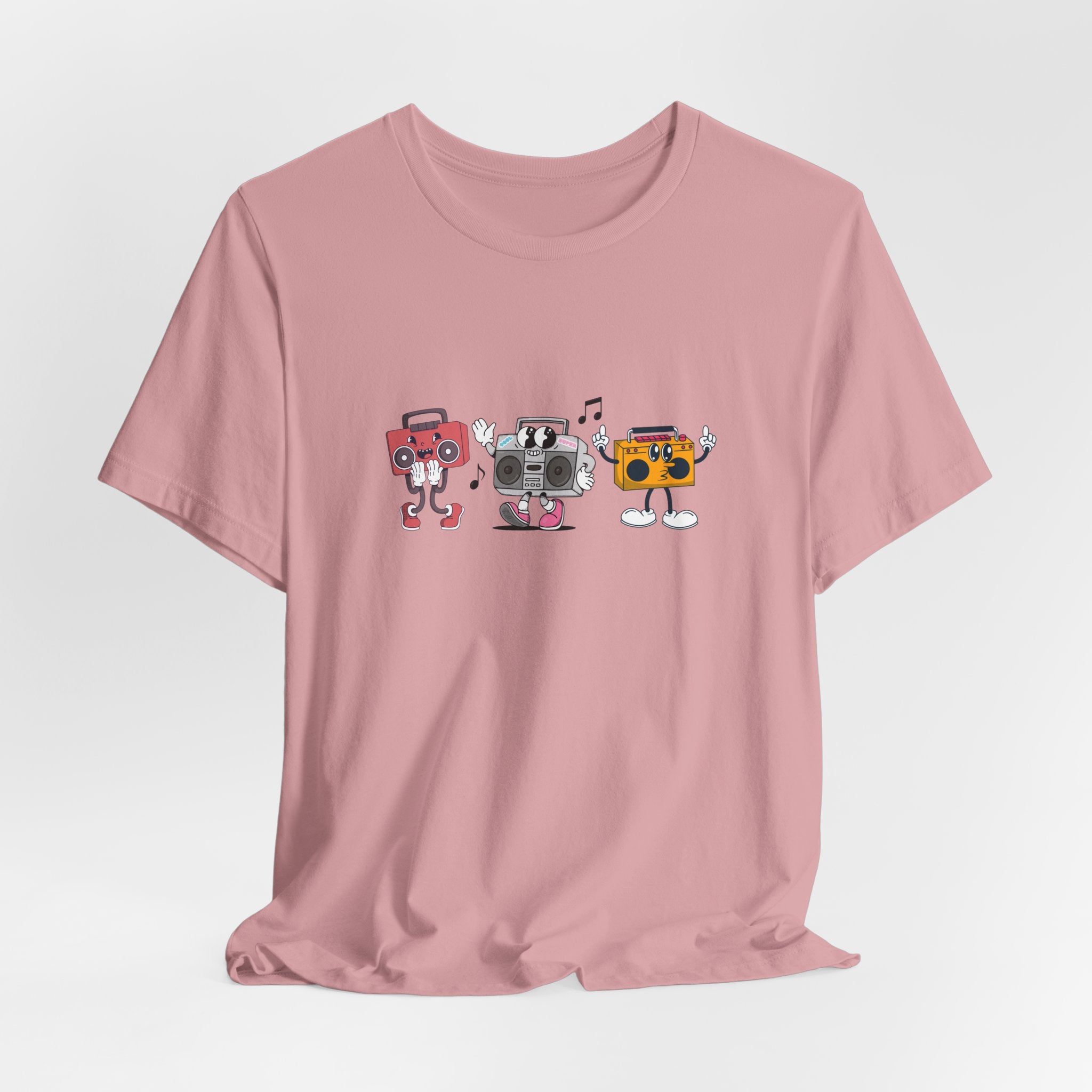 Pink t-shirt with cartoon boombox design on a light gray background