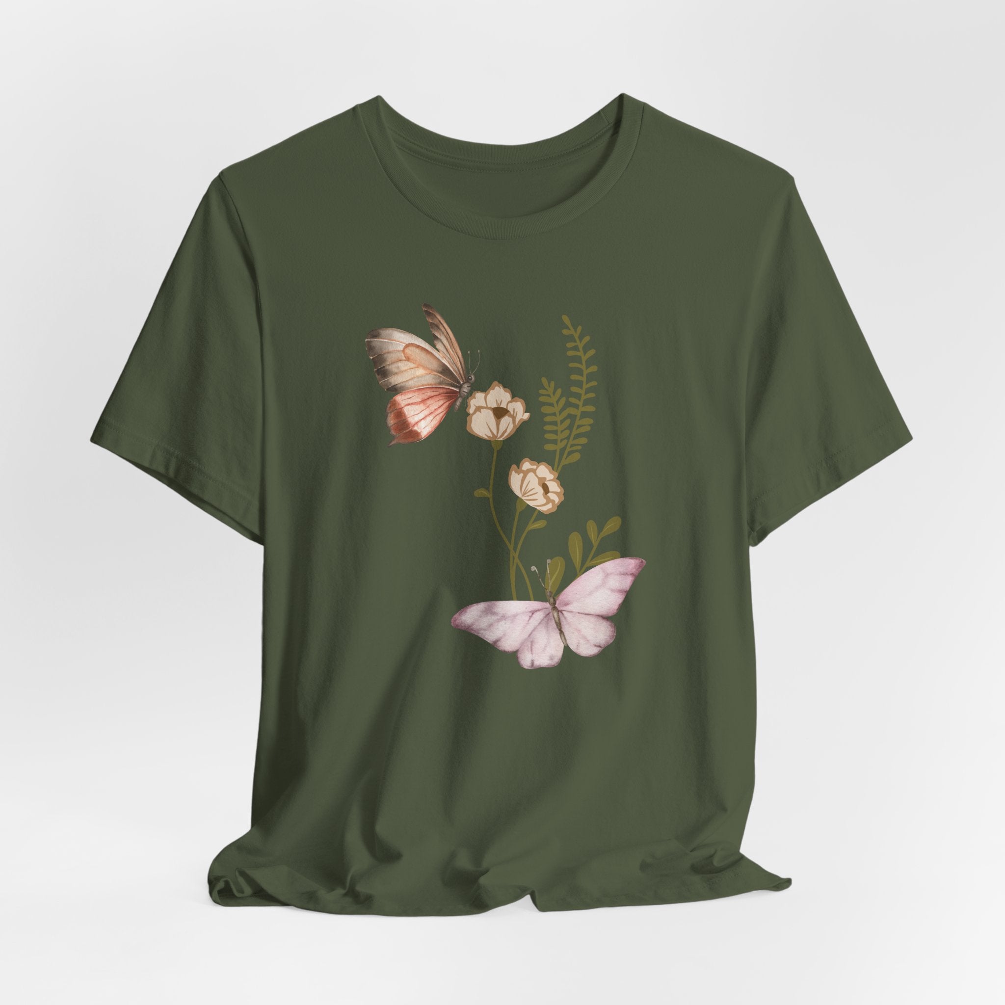 Green t-shirt with butterfly and floral design on a white background
