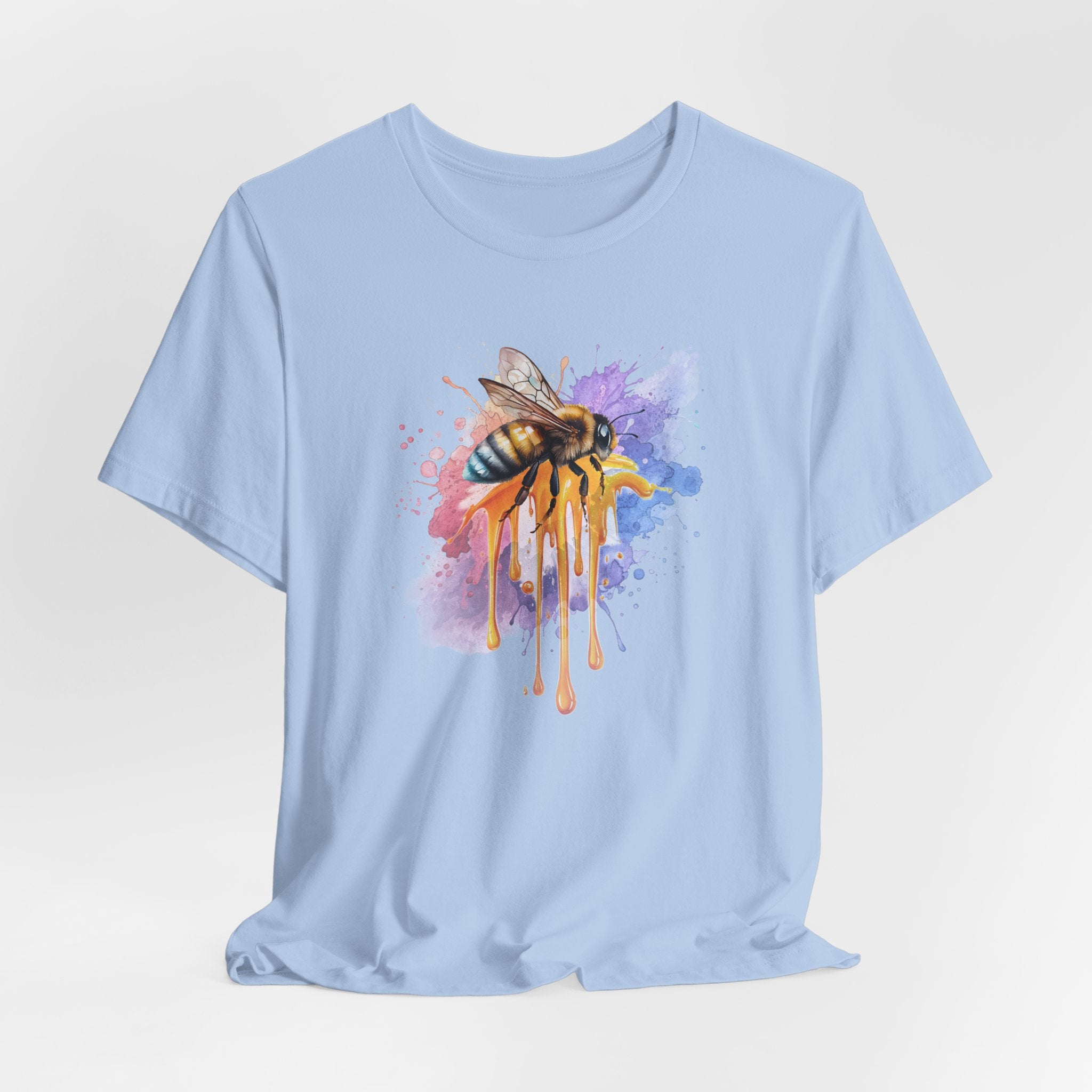 Light blue t-shirt with a colorful bee graphic on a light gray background