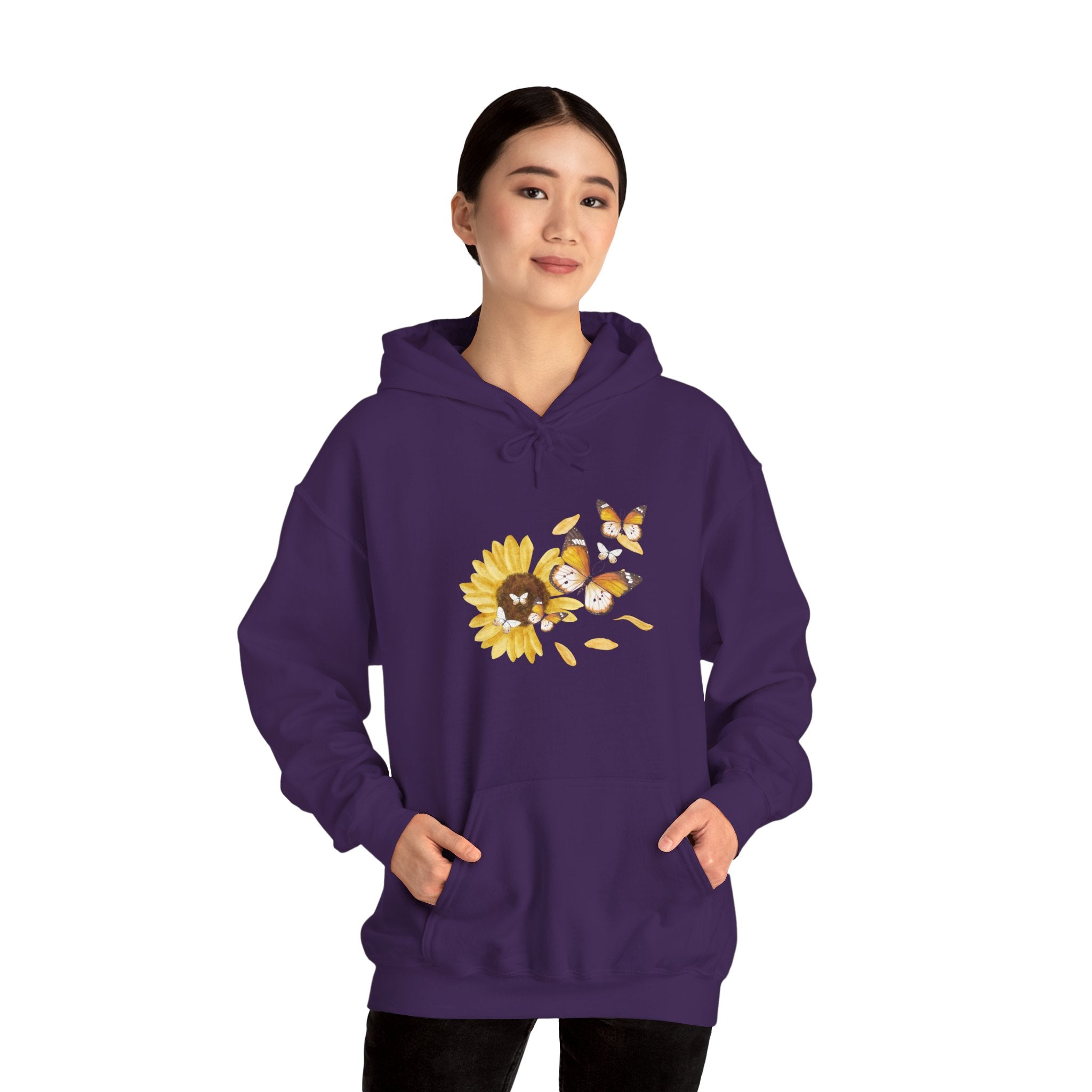 Person wearing a purple hoodie with a sunflower design on a white background