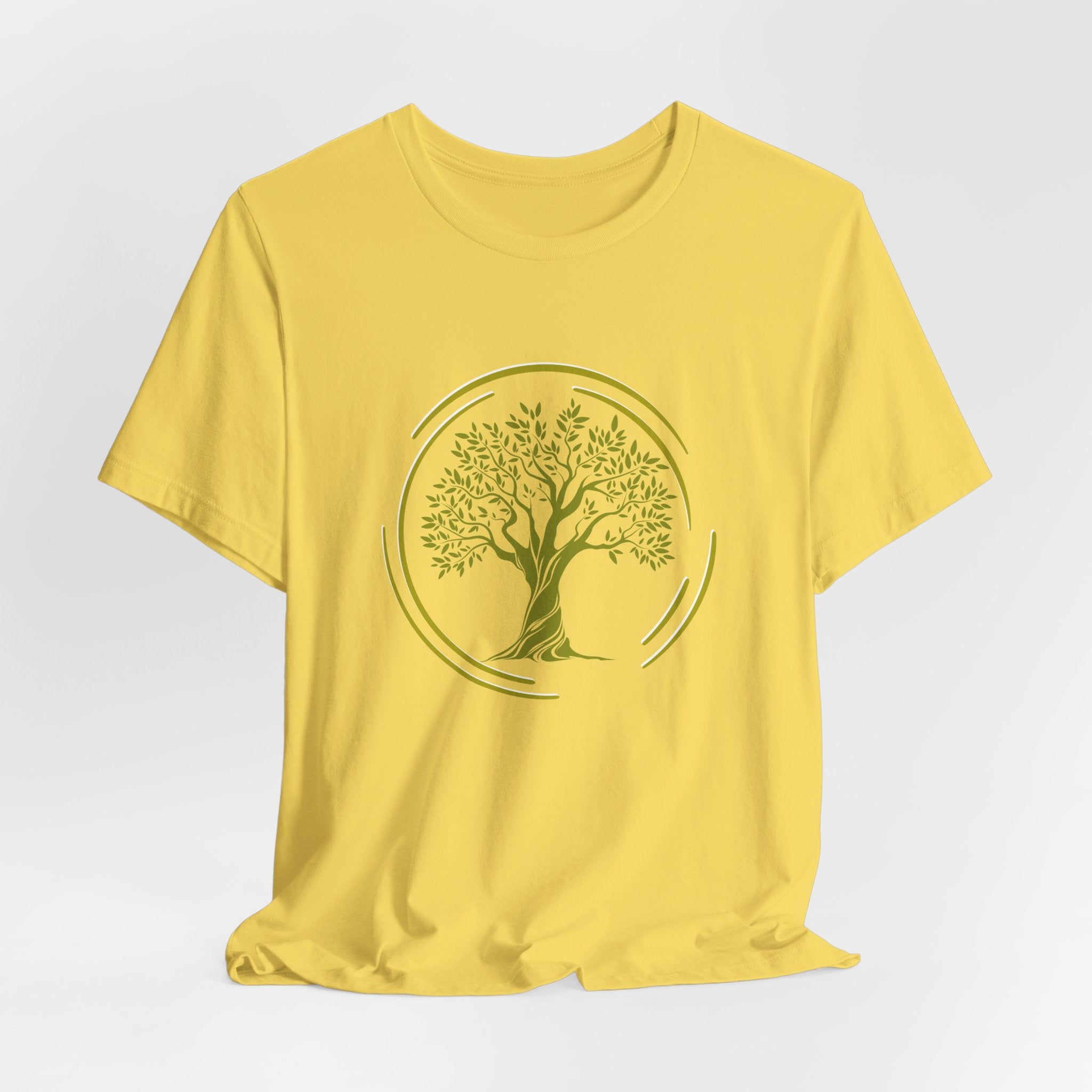 Yellow t-shirt with a tree design on a light gray background