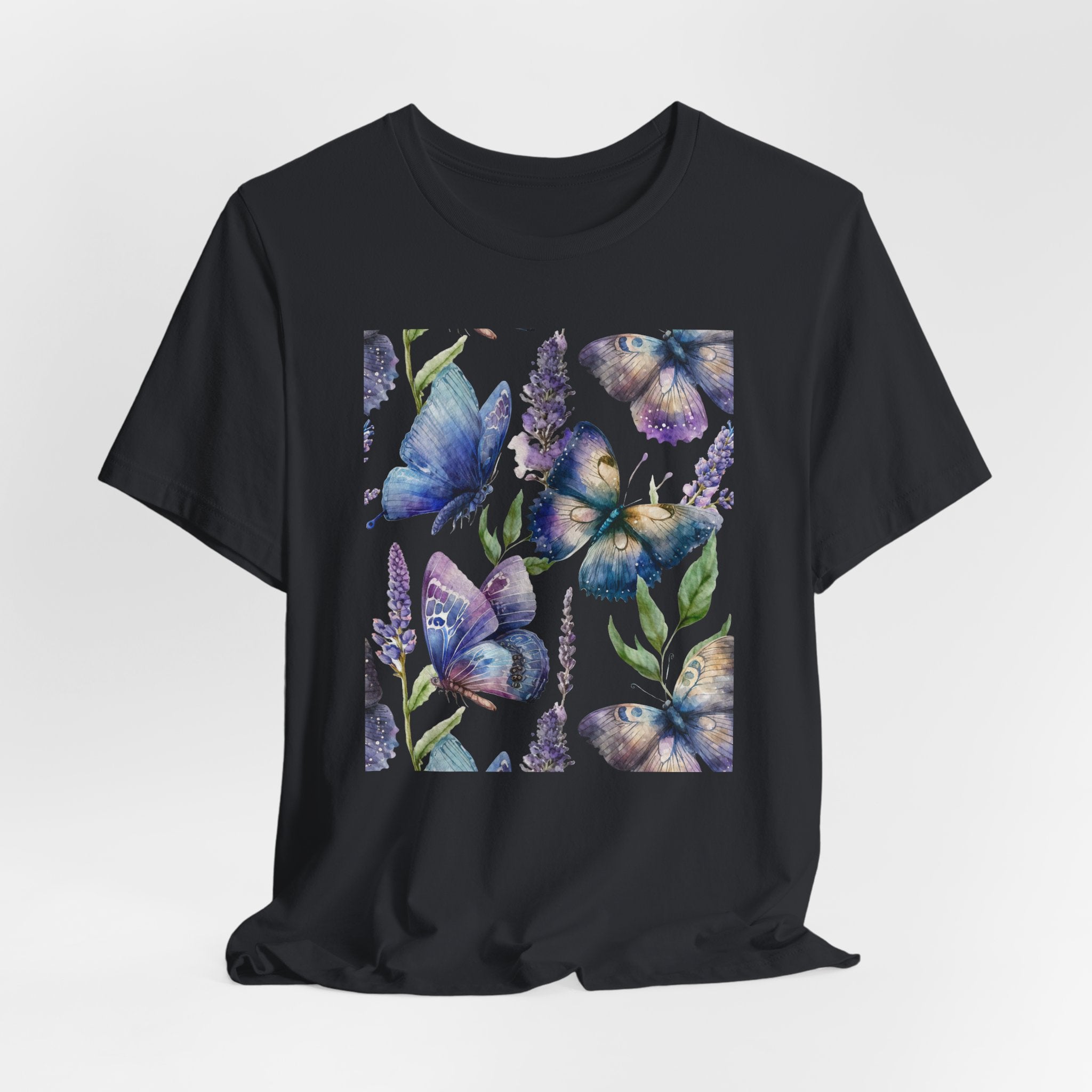 Black t-shirt with butterfly and floral design on a light gray background