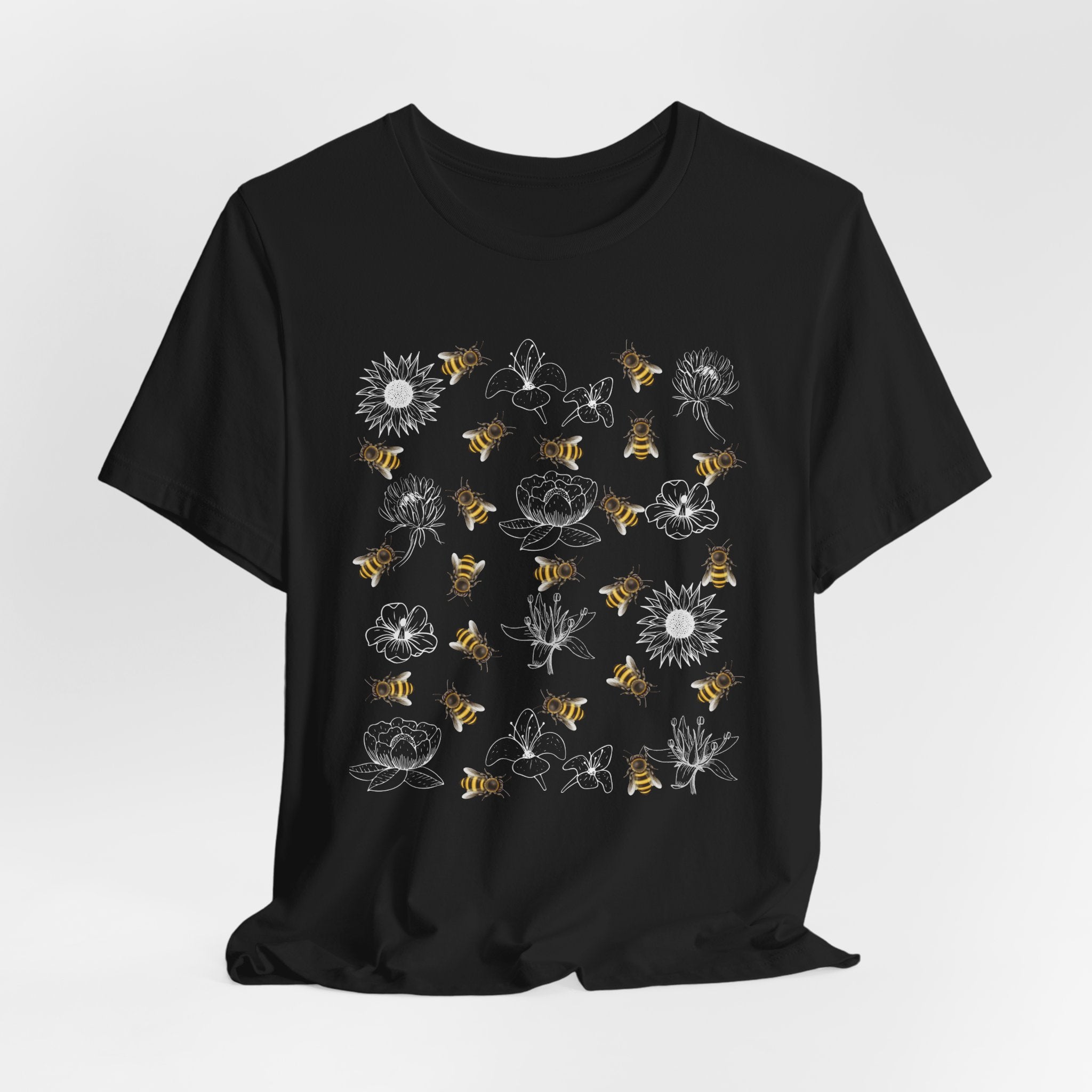 Black t-shirt with white graphic design on a light gray background