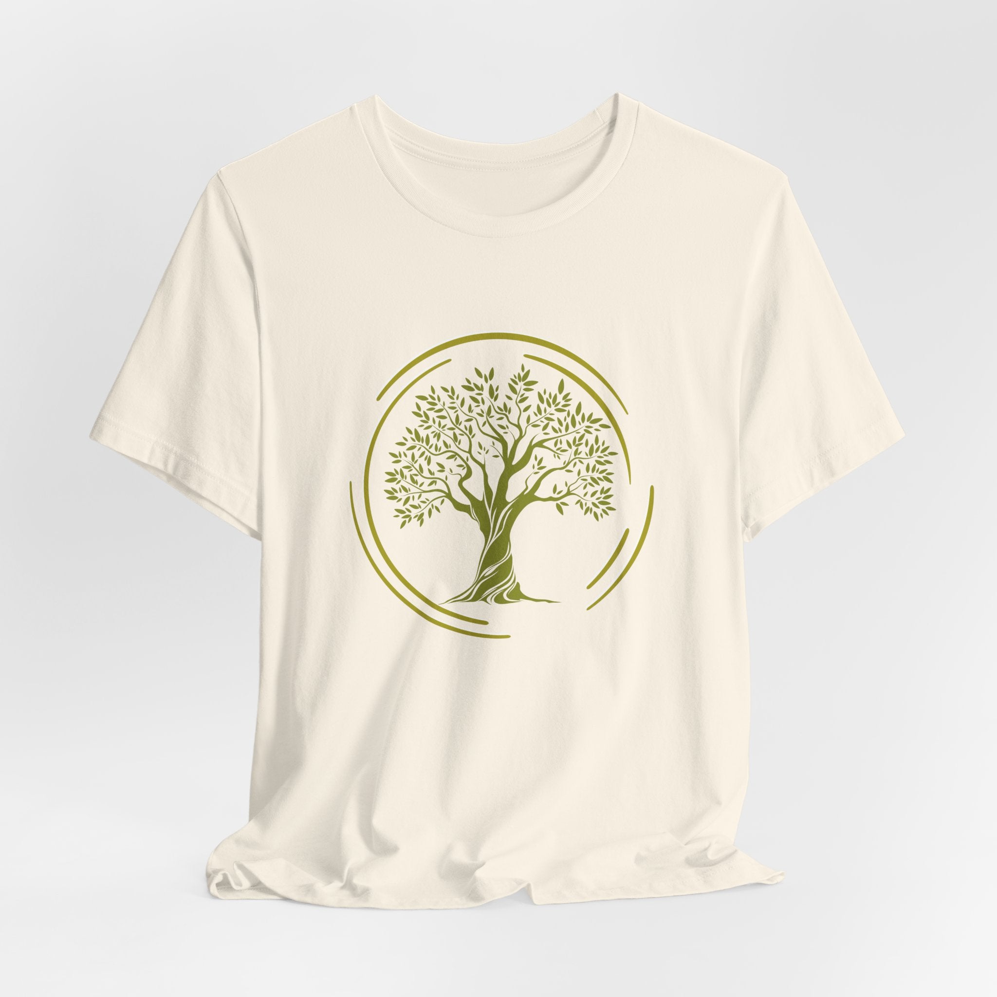 White t-shirt with a green tree design on a light gray background