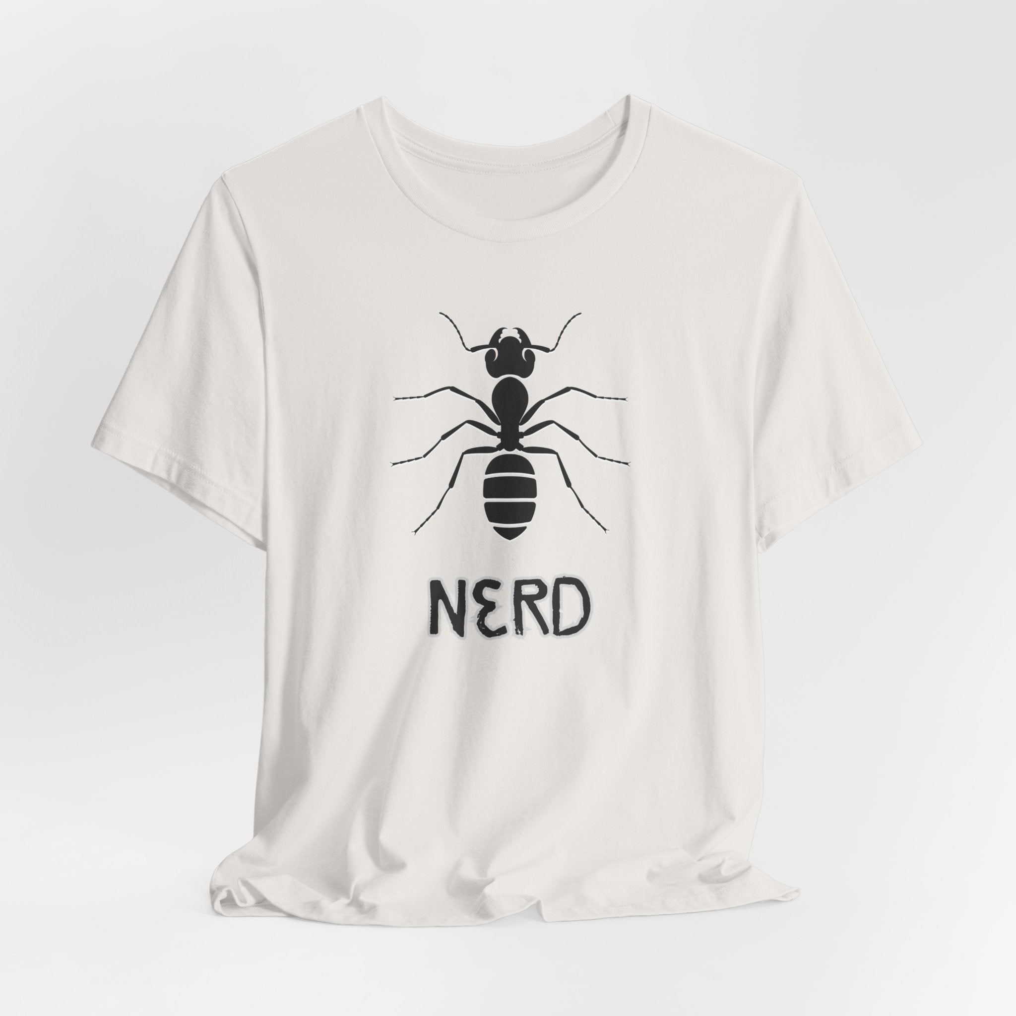 White t-shirt with black ant graphic and 'NERD' text on a light gray background