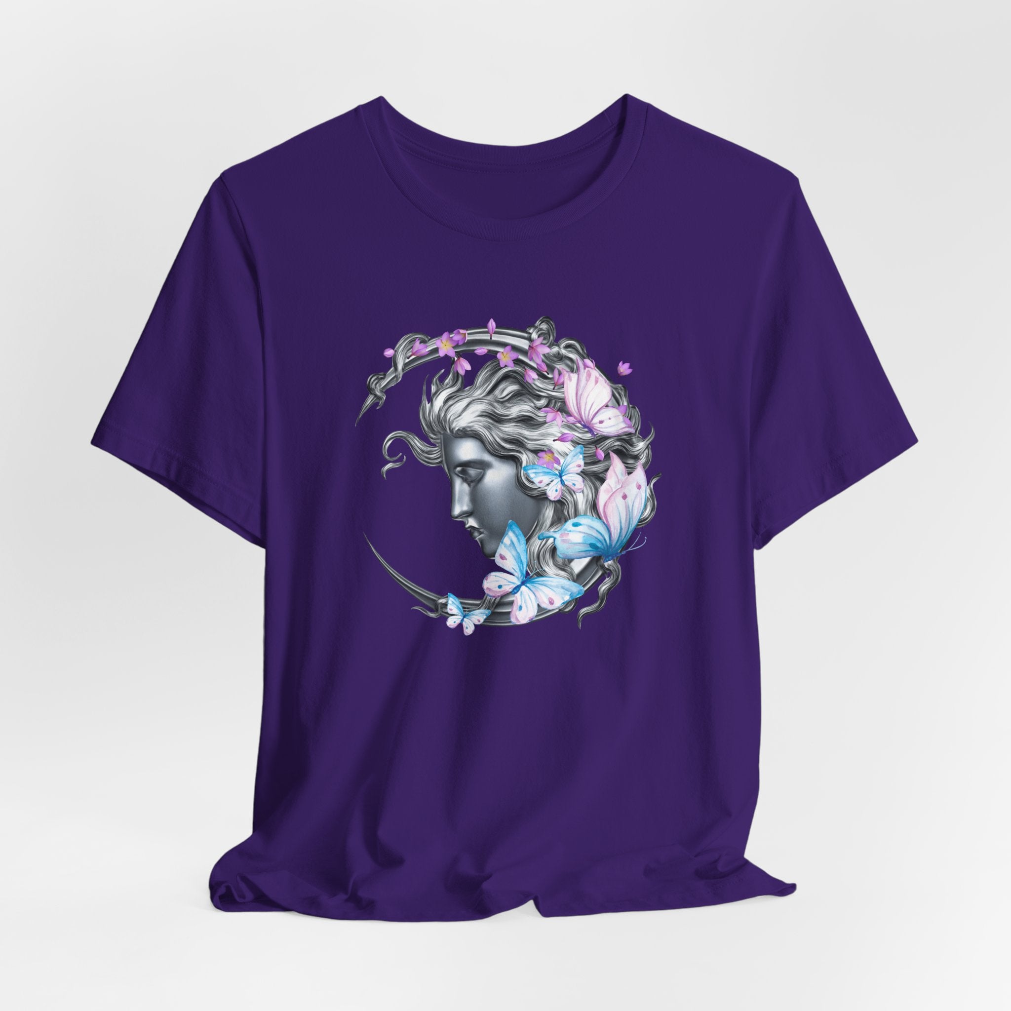 Purple t-shirt with a decorative design on a white background