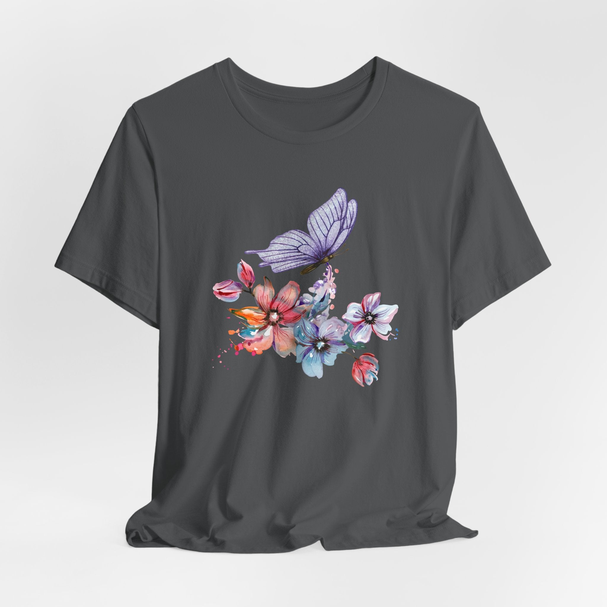 Black t-shirt with colorful butterfly and floral design on a white background