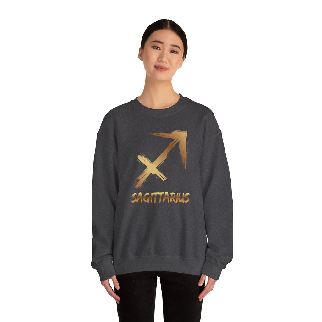 Person wearing a dark gray sweatshirt with a gold Sagittarius symbol on a white background