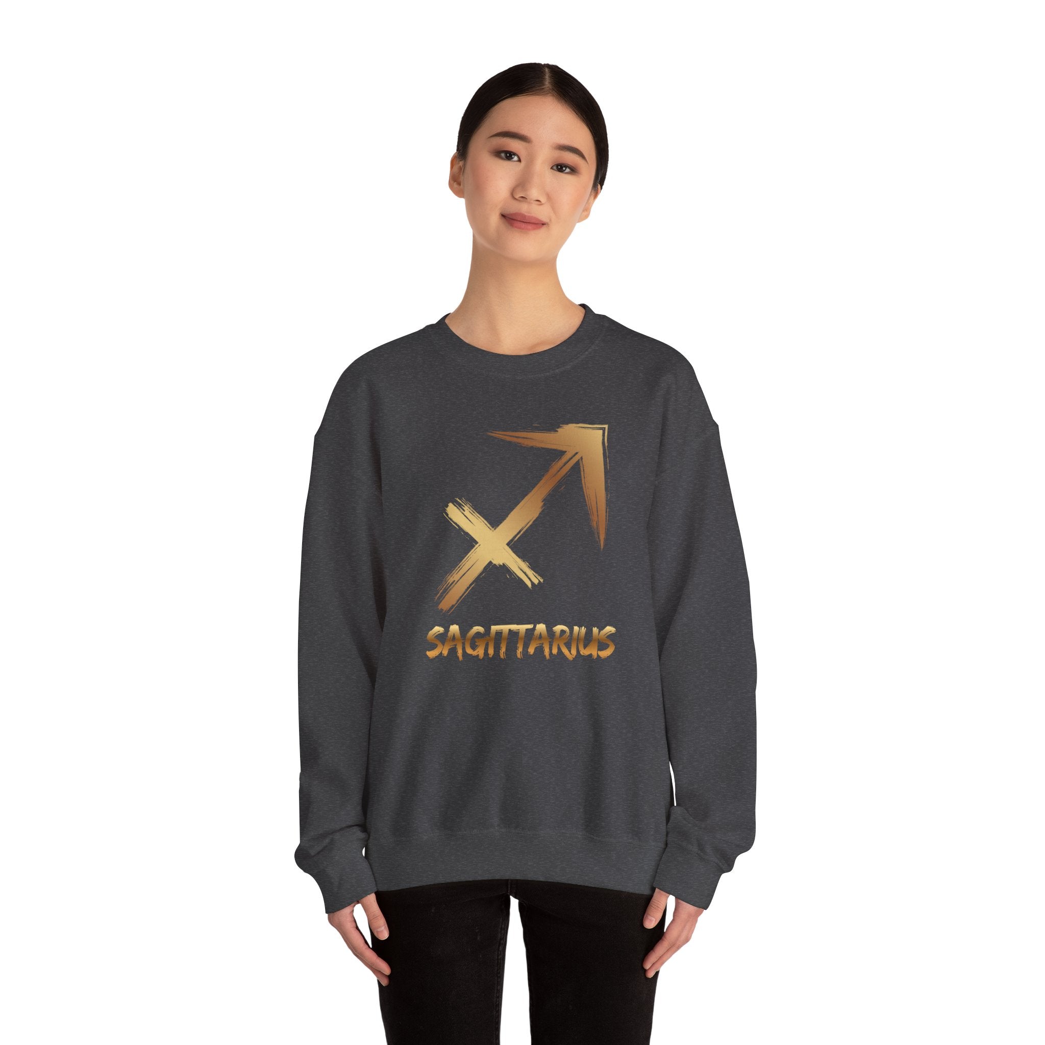 Person wearing a dark gray sweatshirt with a gold Sagittarius symbol on a white background