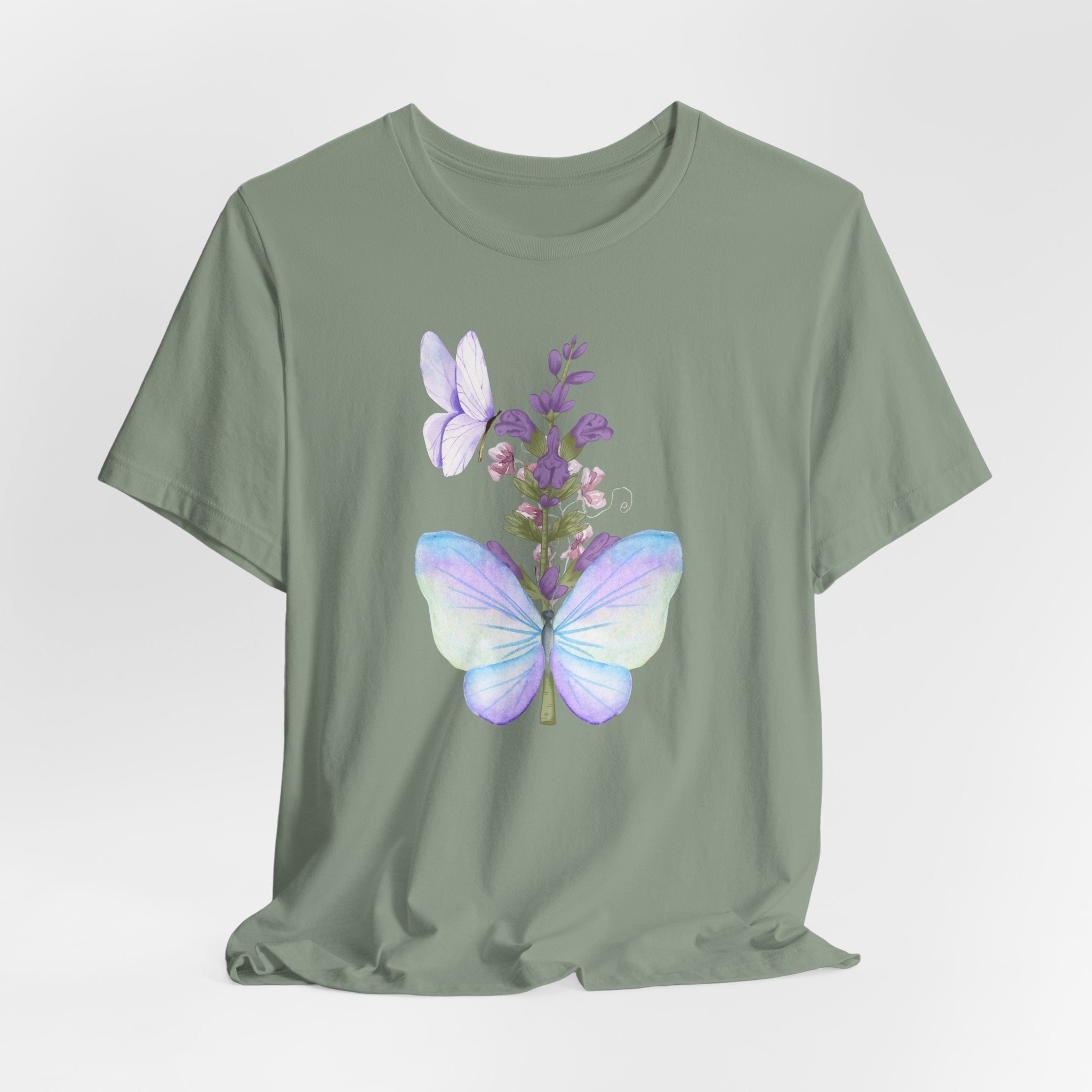 Green t-shirt with butterfly and floral design on a light gray background