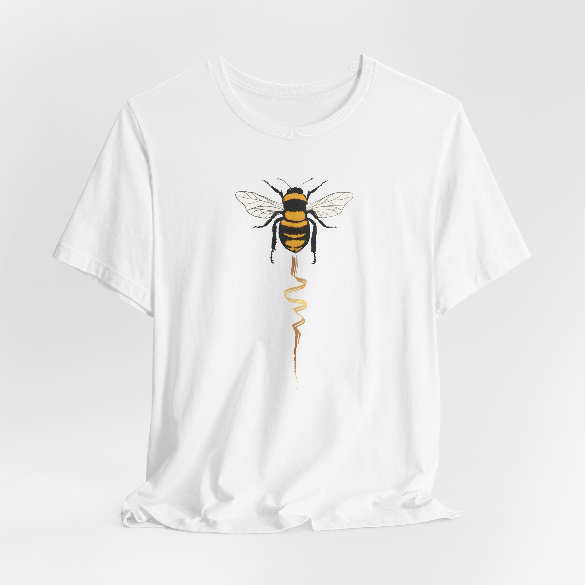 White t-shirt with a bee graphic on a white background