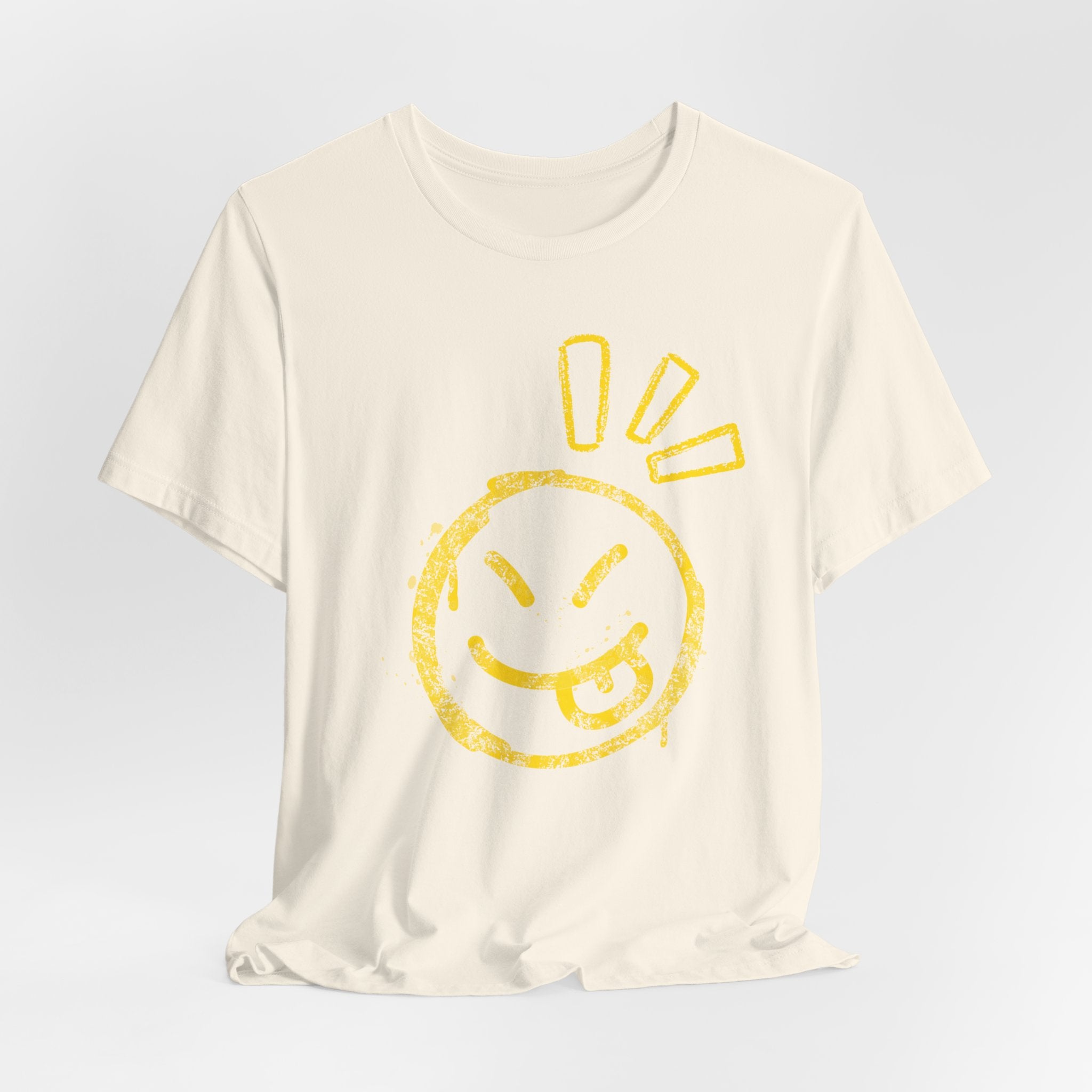White t-shirt with a yellow smiley face design on a light gray background