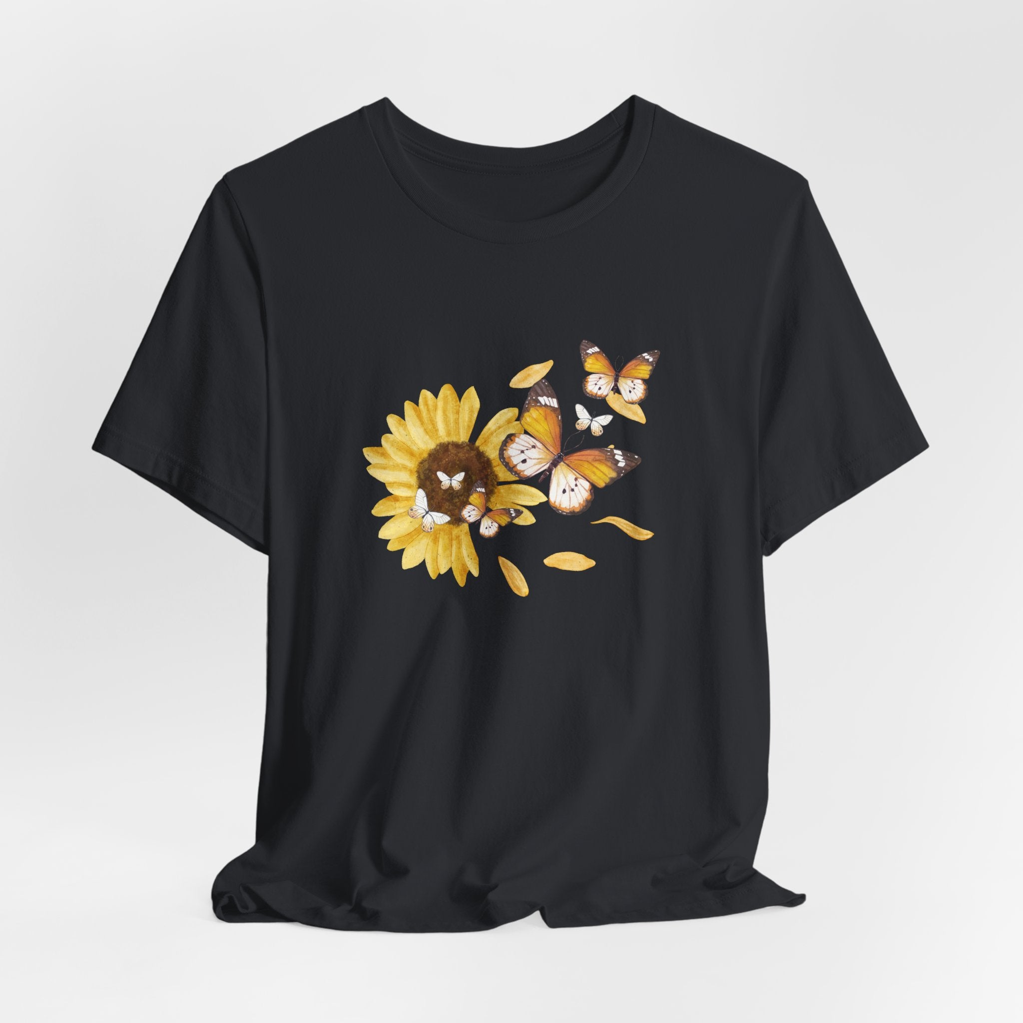 Black t-shirt with a sunflower and butterfly design on a white background