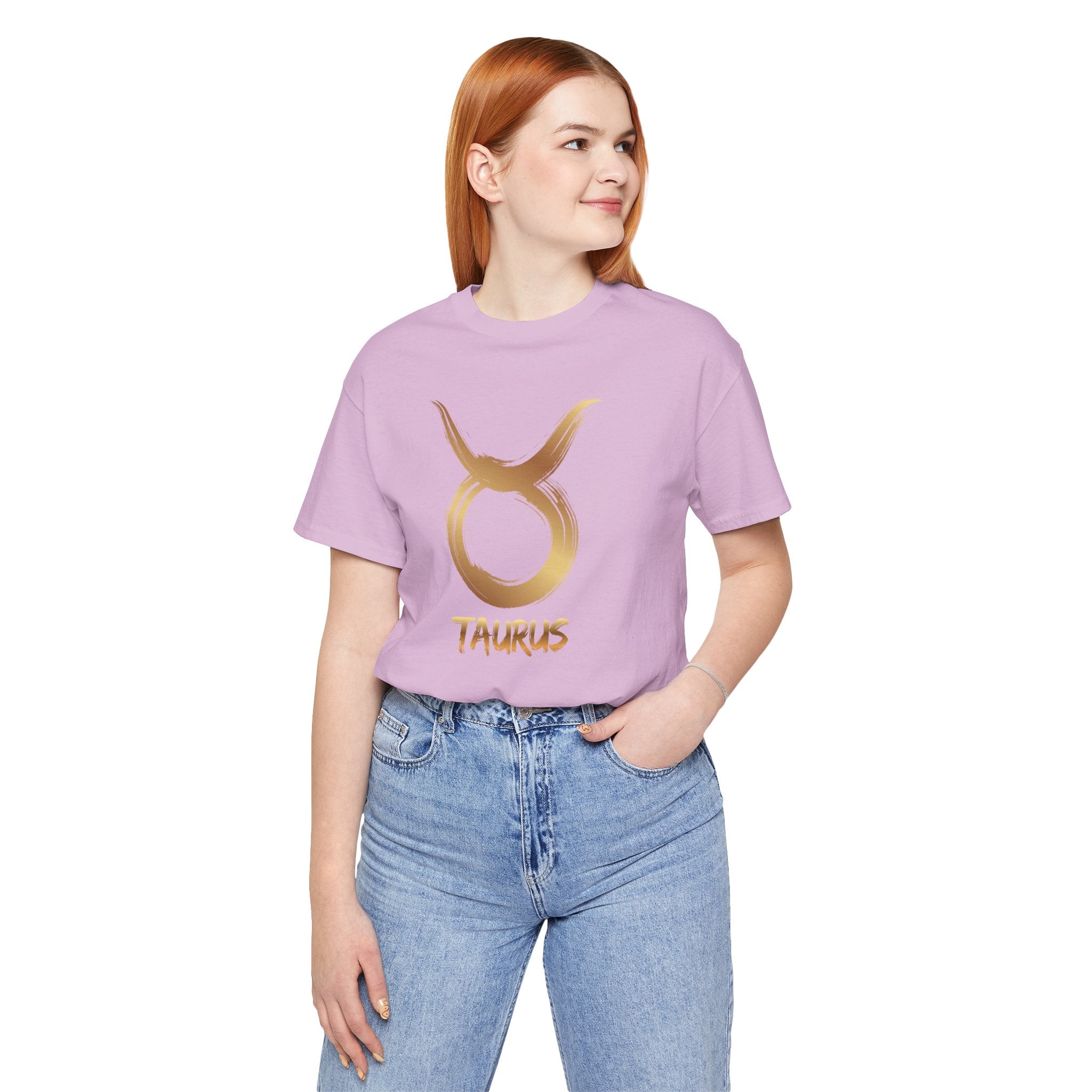Person wearing a purple Taurus t-shirt with a gold symbol on a white background