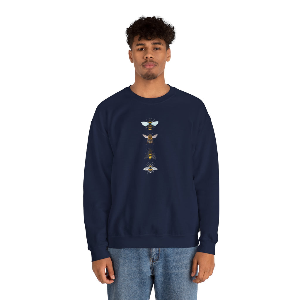 Man wearing a navy blue sweatshirt with bee illustrations on a white background