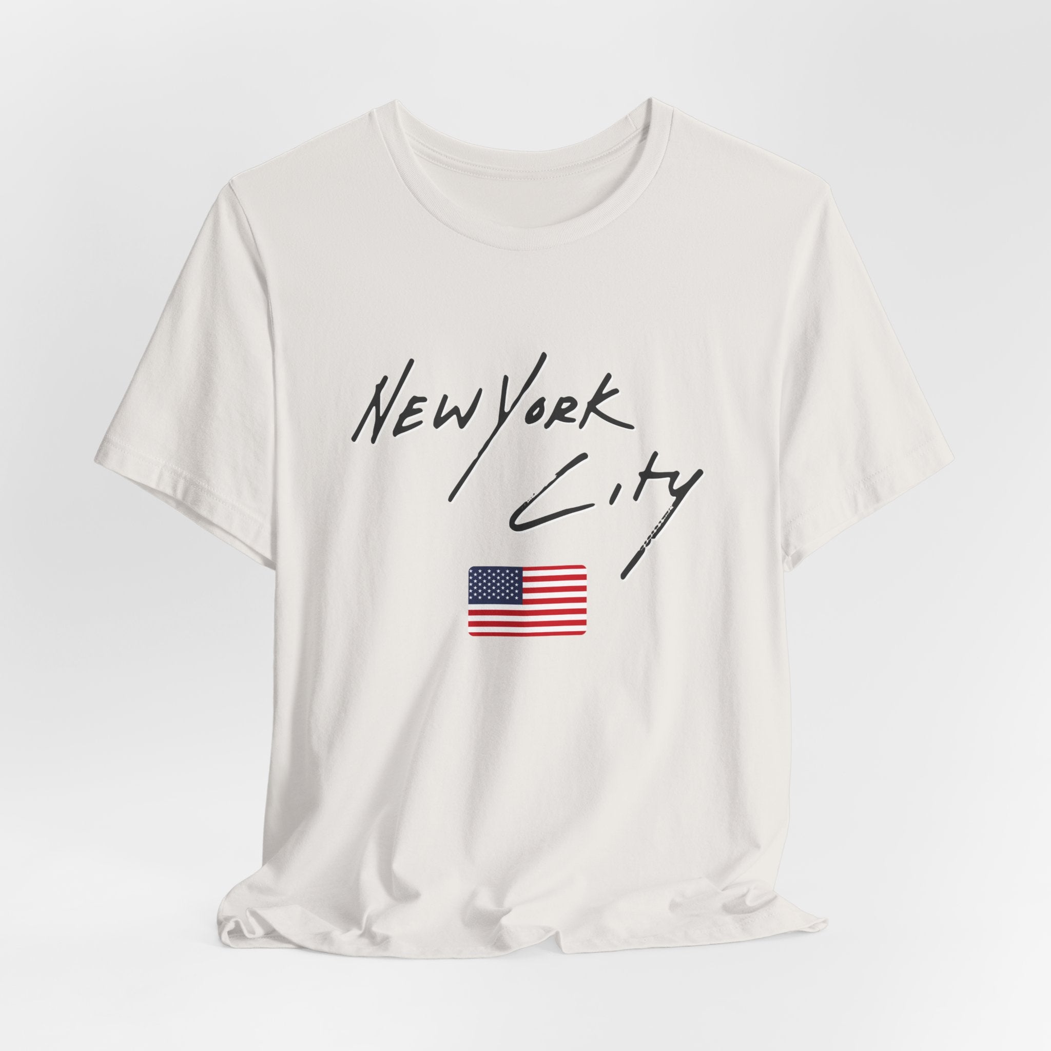 White t-shirt with 'New York City' text and American flag on a white background