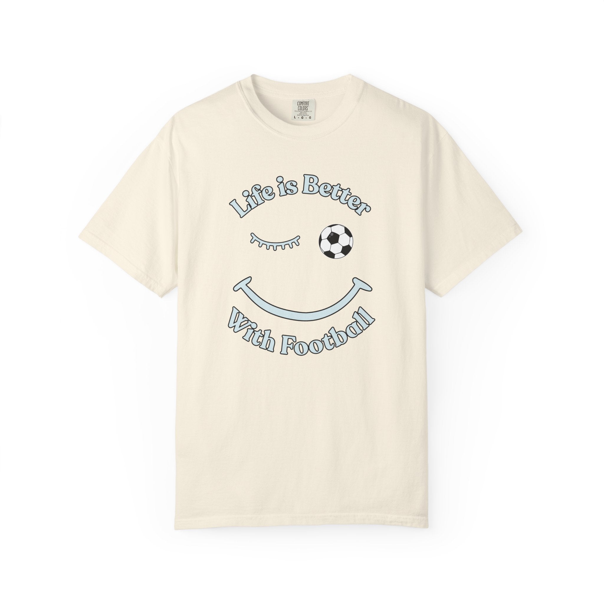 Beige t-shirt with 'Life is Better With Football' text and smiley face design on a white background