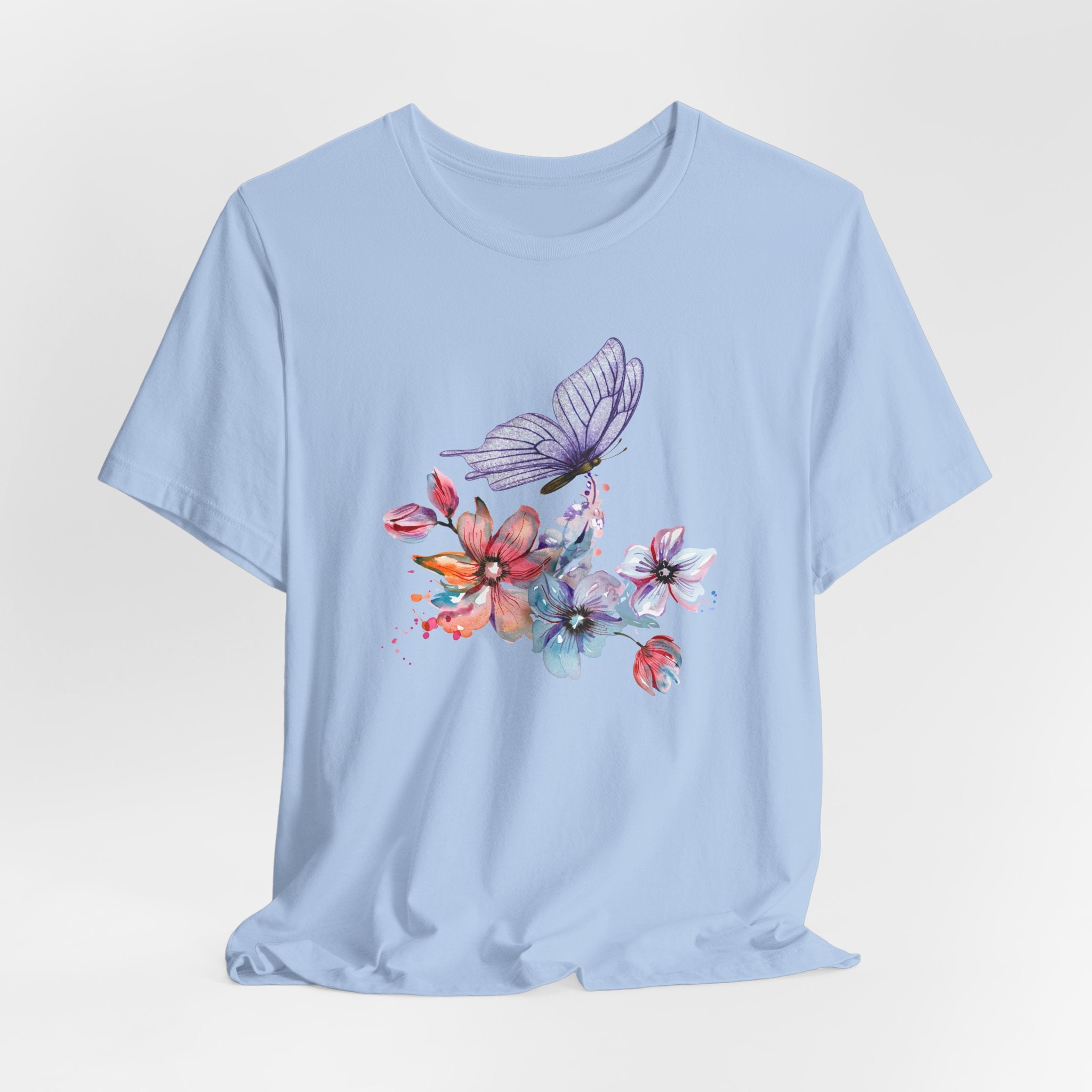 Light blue t-shirt with a butterfly and floral design on a light gray background
