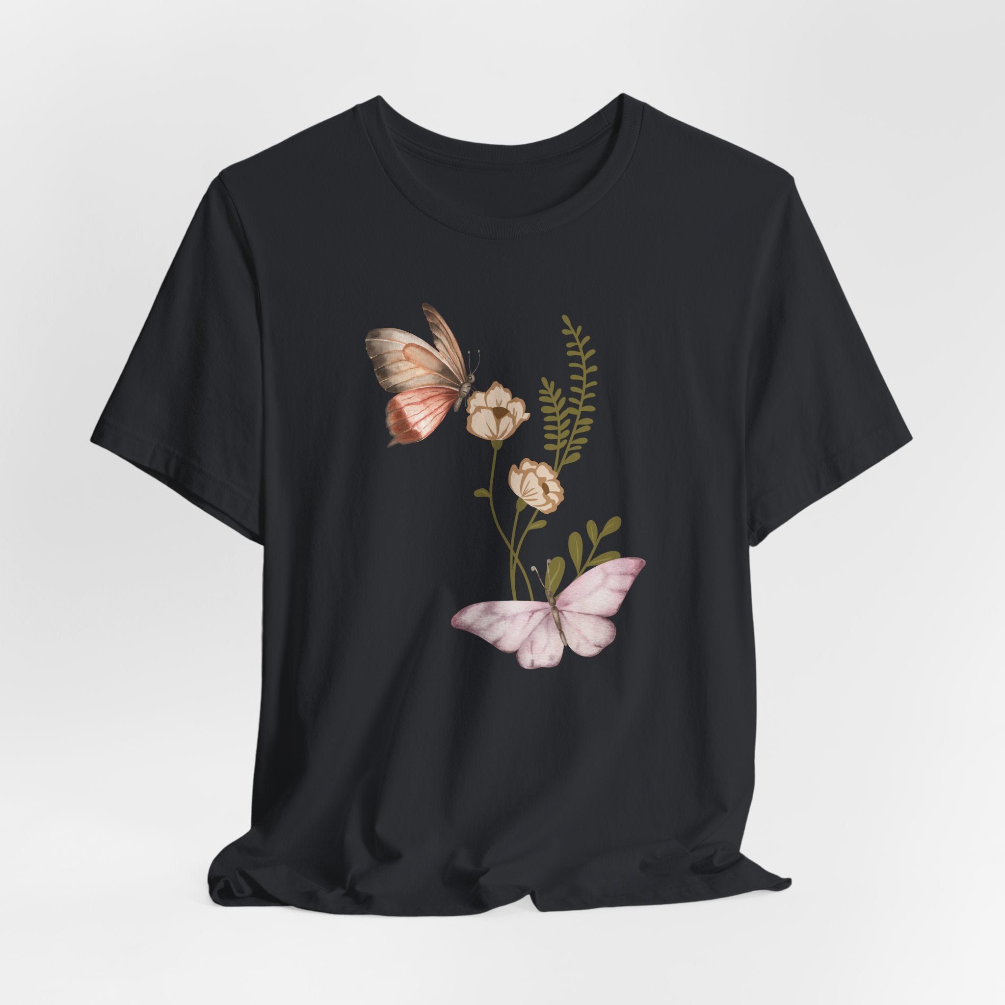 Black t-shirt with butterfly and floral design on a white background
