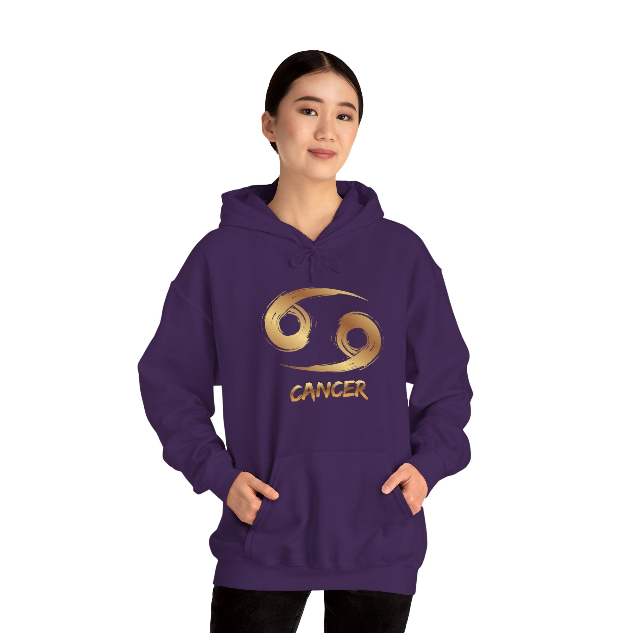Person wearing a purple hoodie with 'Cancer' and a zodiac symbol on a white background