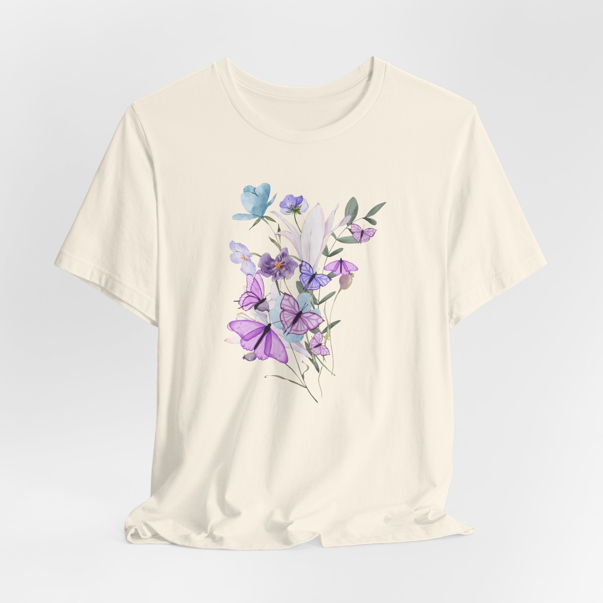 White t-shirt with floral design on a light gray background