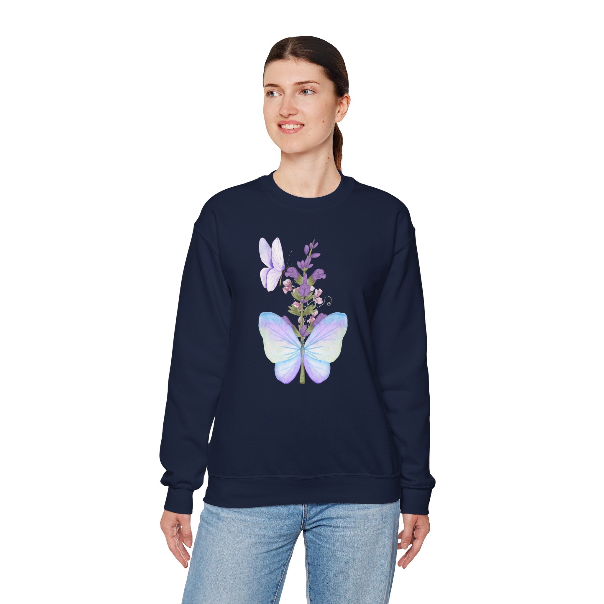 Person wearing a navy sweatshirt with a butterfly design on a white background