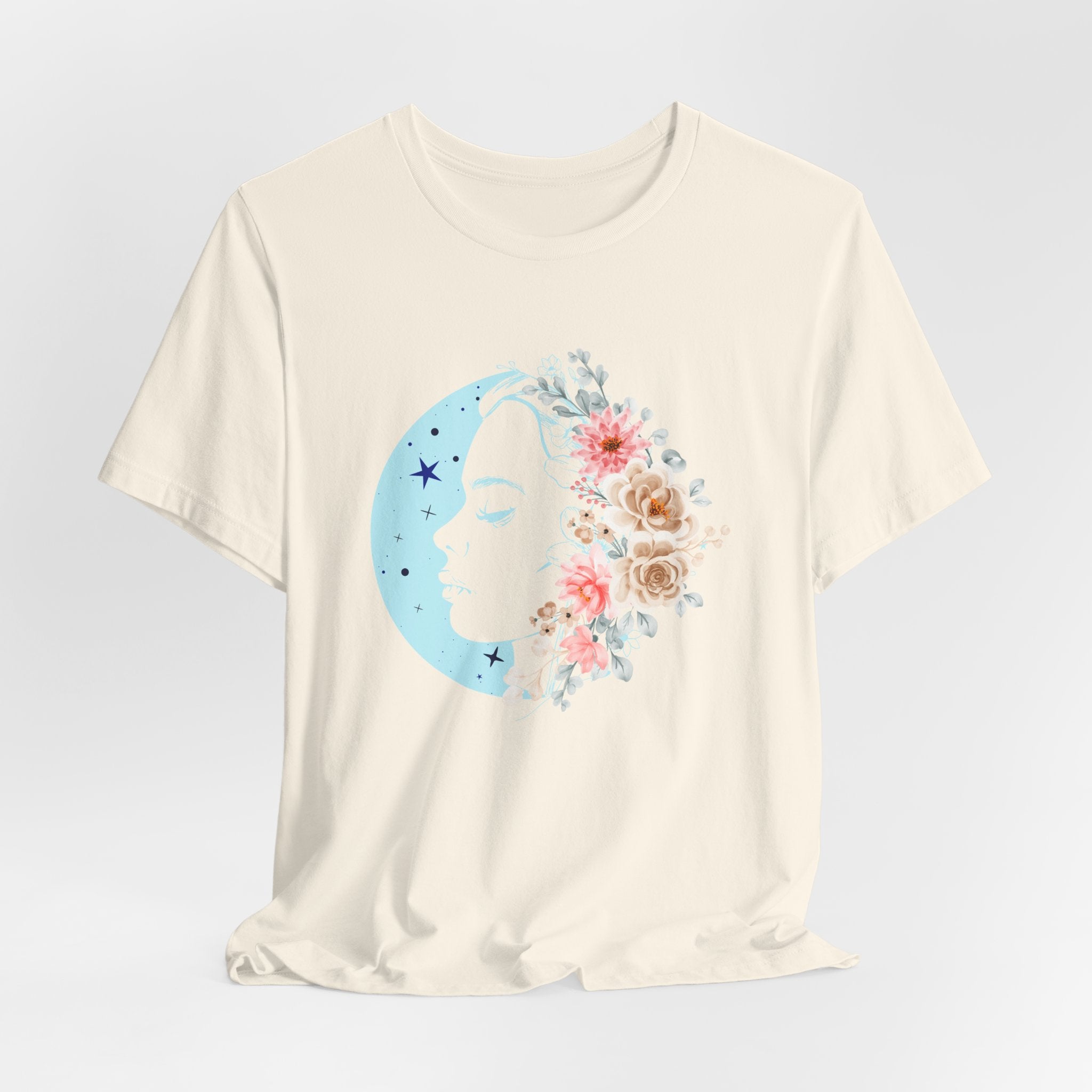 White t-shirt with a moon and floral design on a light gray background