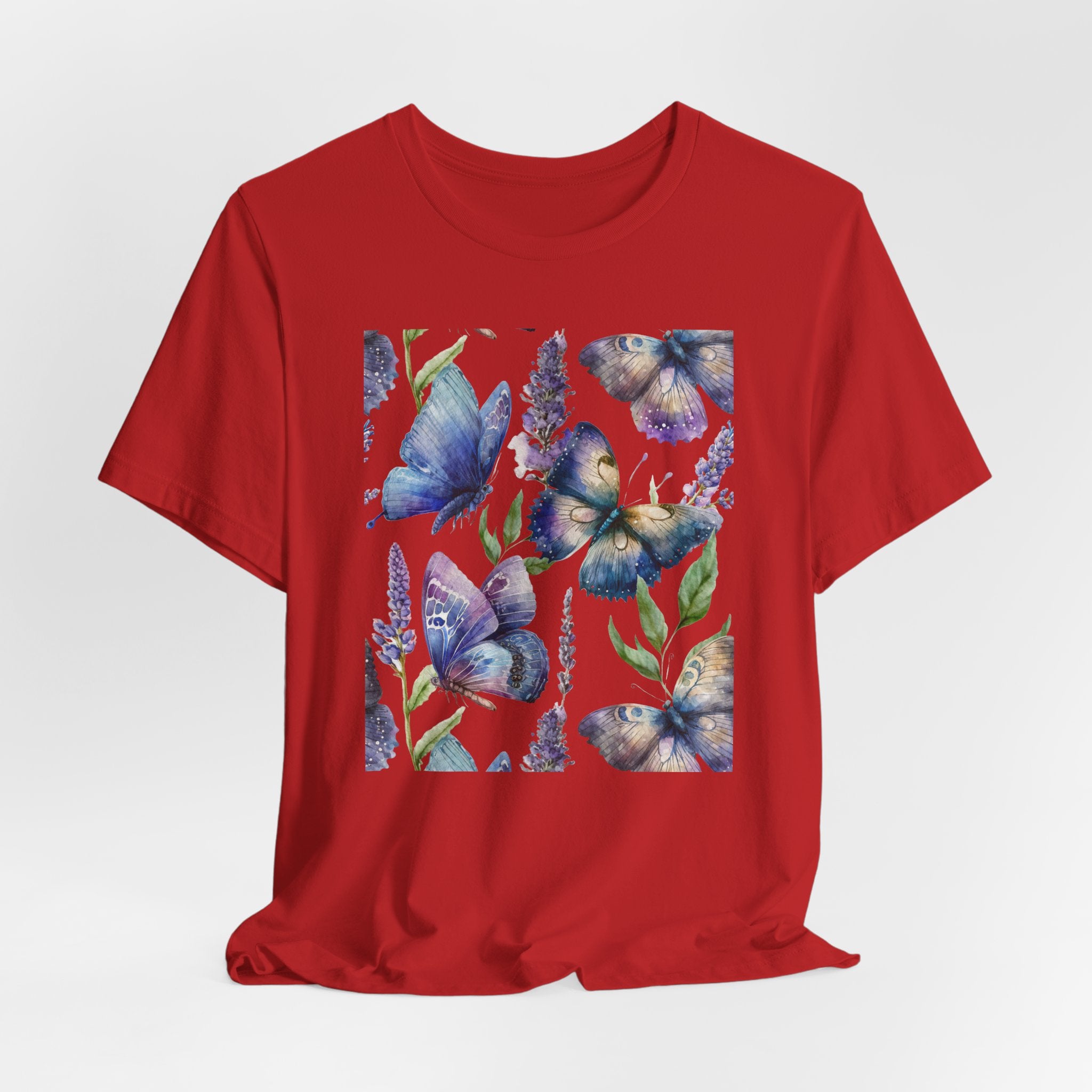Red t-shirt with blue butterfly design on a white background