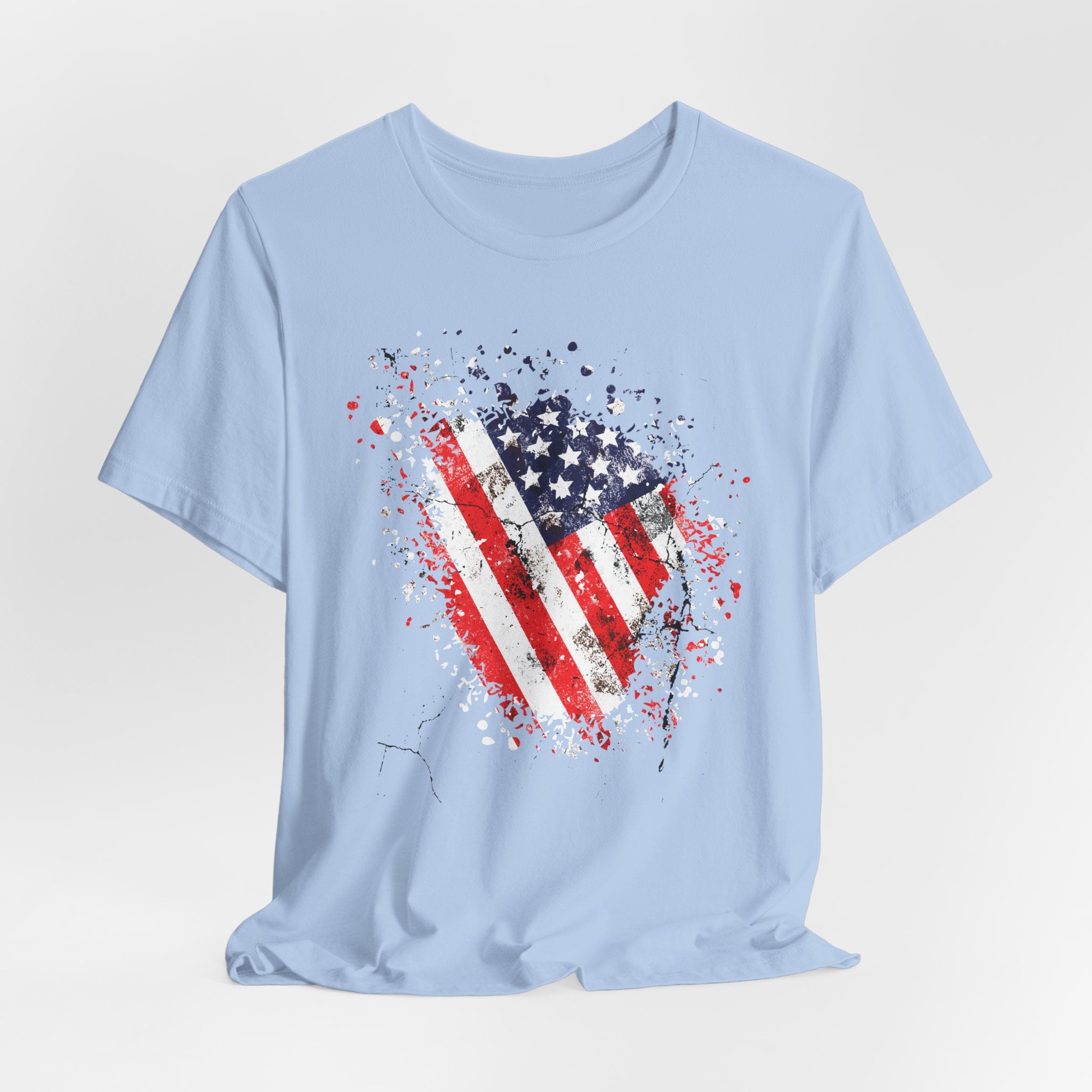 Light blue t-shirt with American flag graphic on a light gray background
