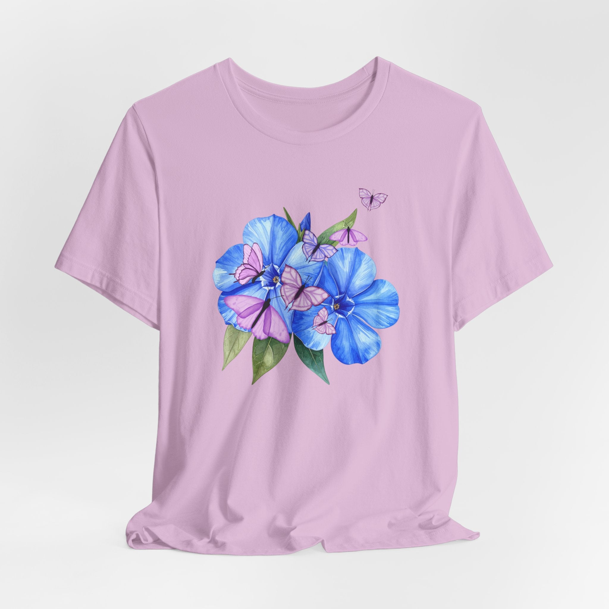 Pink t-shirt with blue floral design on a light gray background