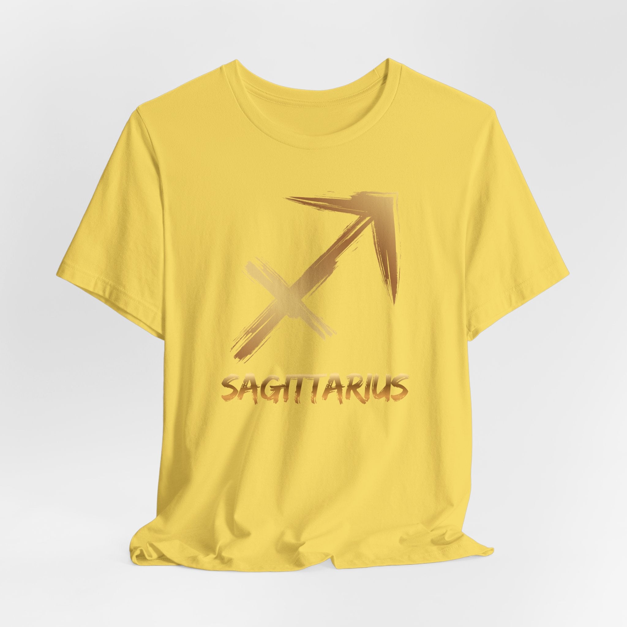 Yellow t-shirt with Sagittarius symbol and text on a light gray background