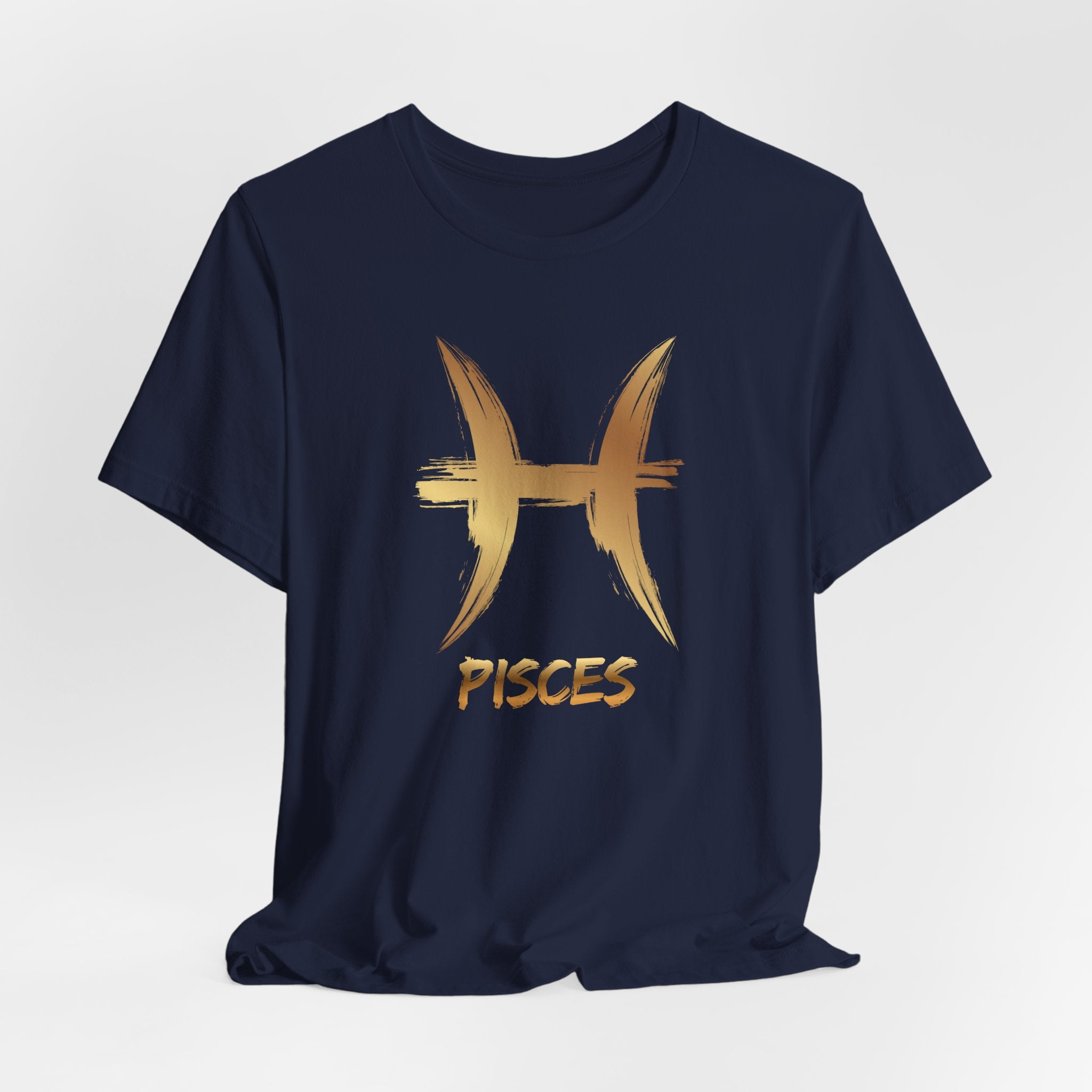 Navy blue t-shirt with gold Pisces zodiac symbol on a light gray background