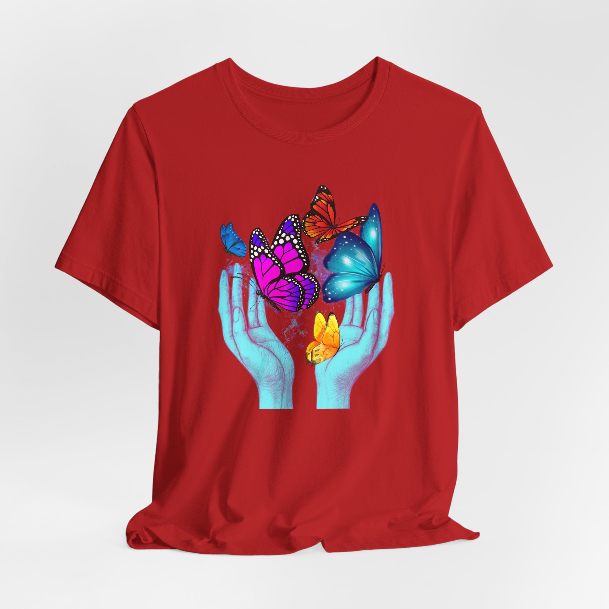 Red t-shirt with colorful butterfly design on a white background