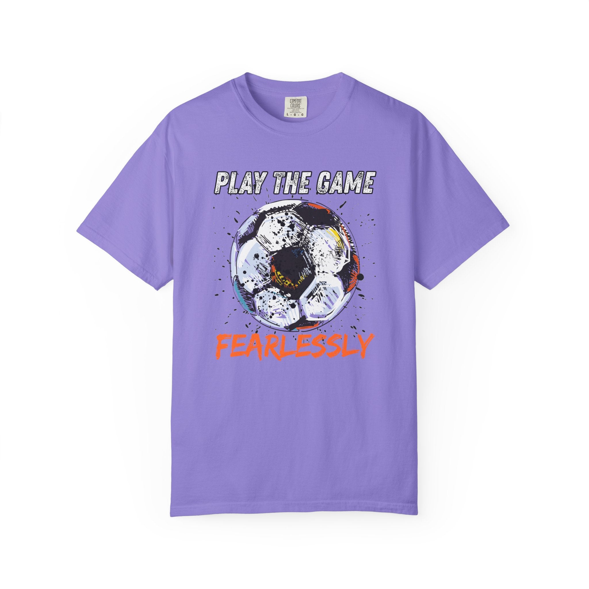 Purple t-shirt with dirty soccer ball graphic and play the game fearlessly text on a white background