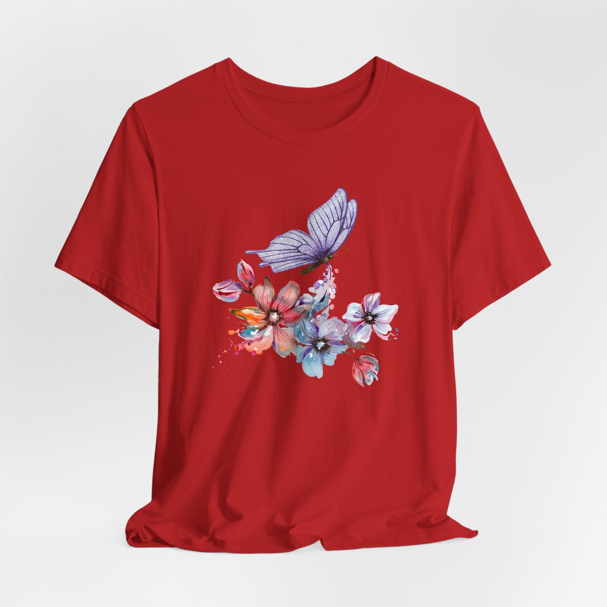 Red t-shirt with a colorful butterfly and floral design on a white background