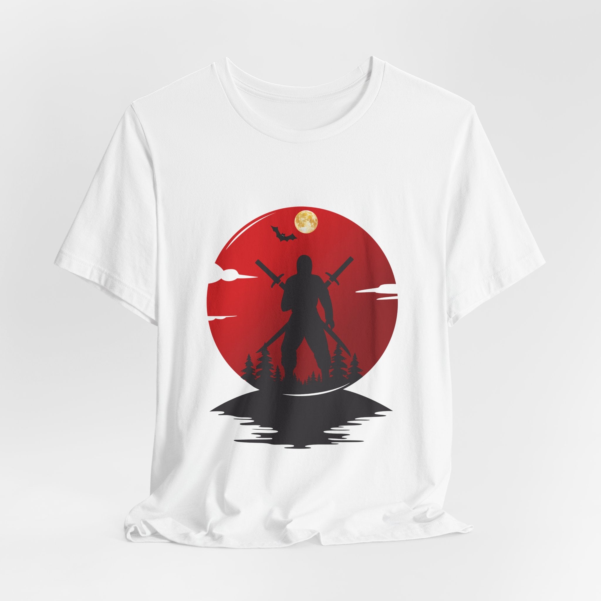 White t-shirt with a red circular design featuring a silhouette of a person holding two swords against a dark background.