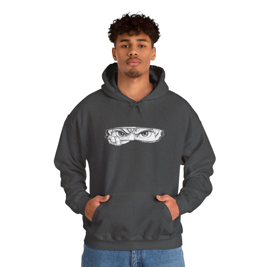 Person wearing a dark gray hoodie with a graphic of a anime eye on a white background
