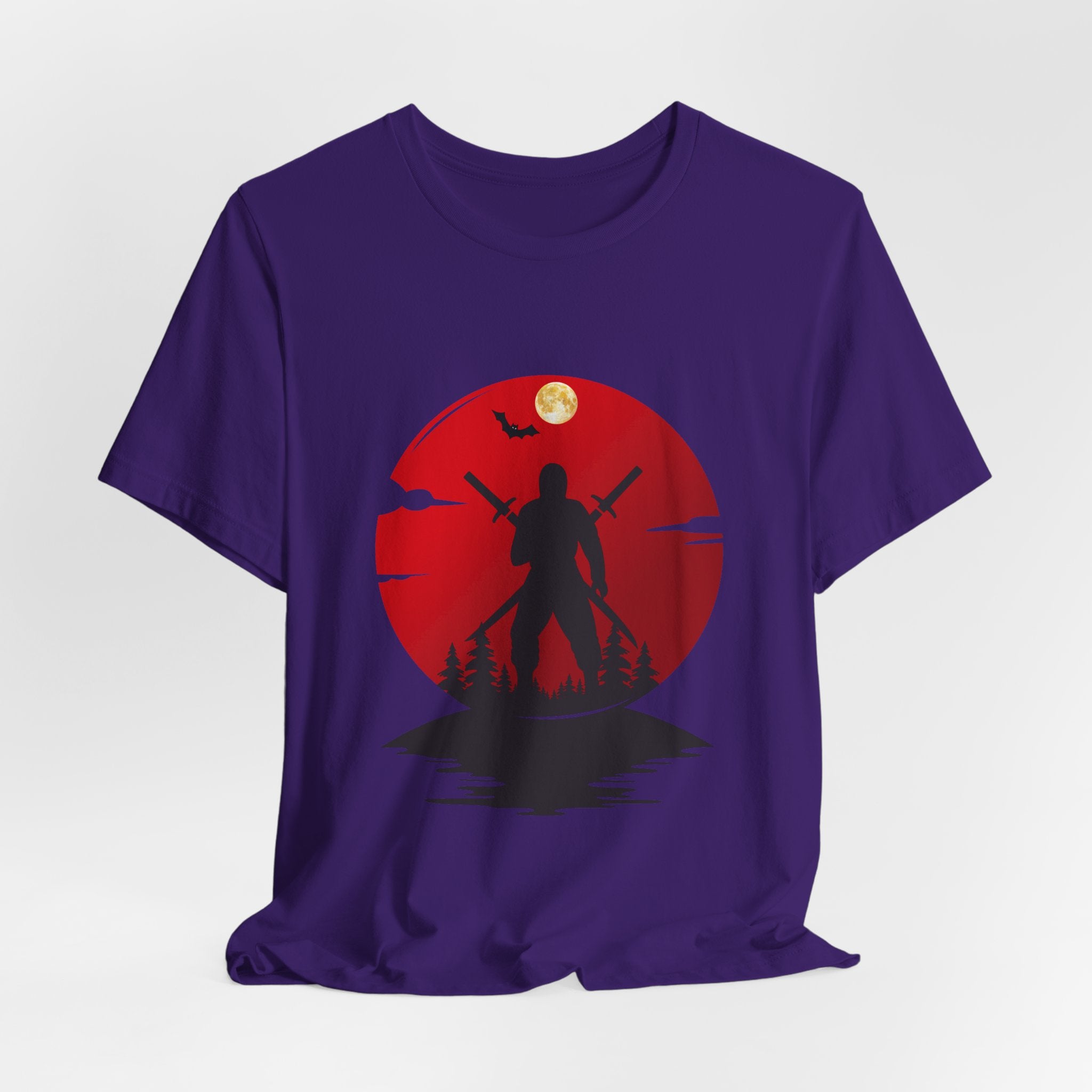 Purple t-shirt with a silhouette design of a person holding a spear against a red circle with a moon and bats on a white background.