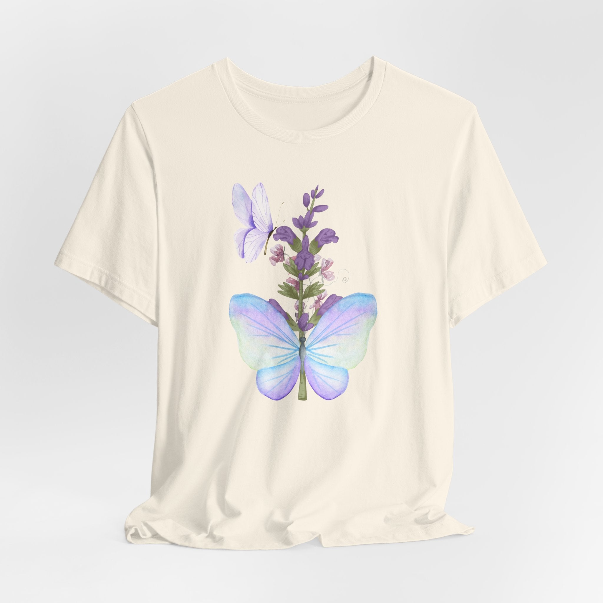 White t-shirt with a butterfly and lavender graphic on a light gray background