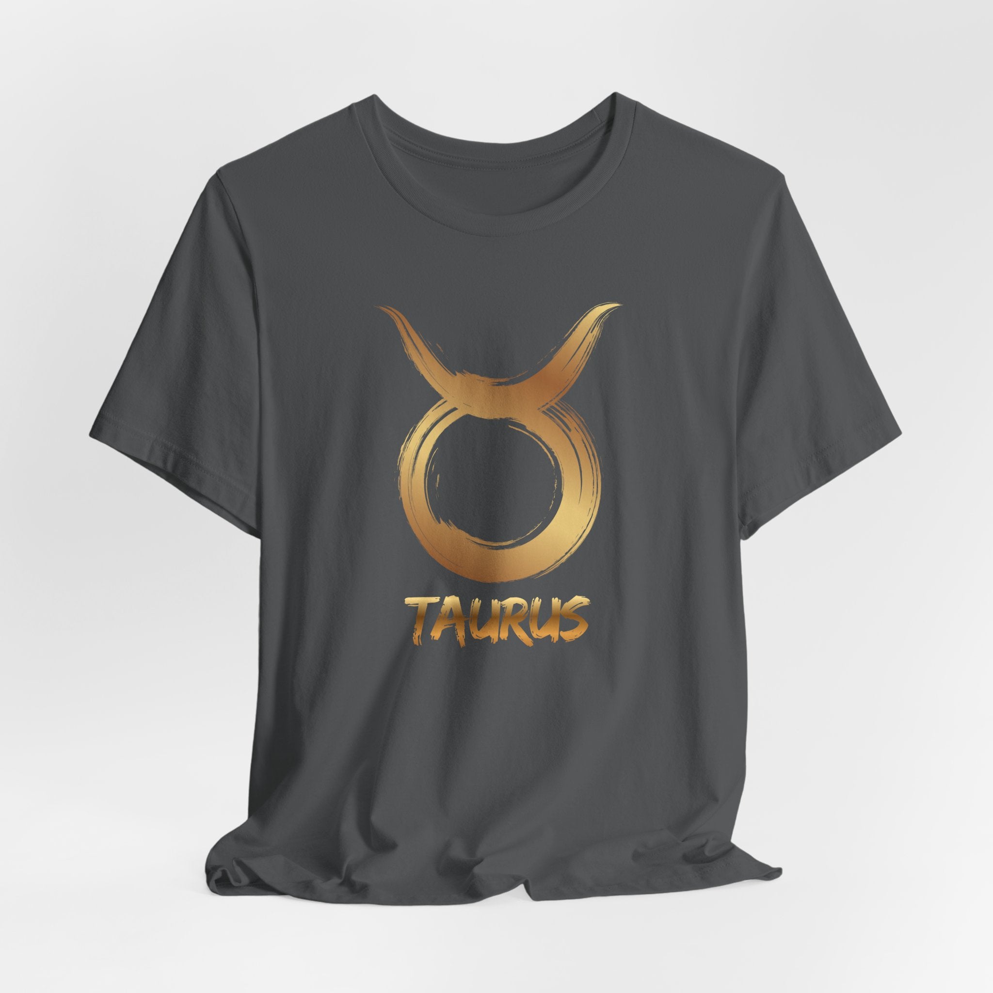 Black t-shirt with gold Taurus zodiac symbol on a white background