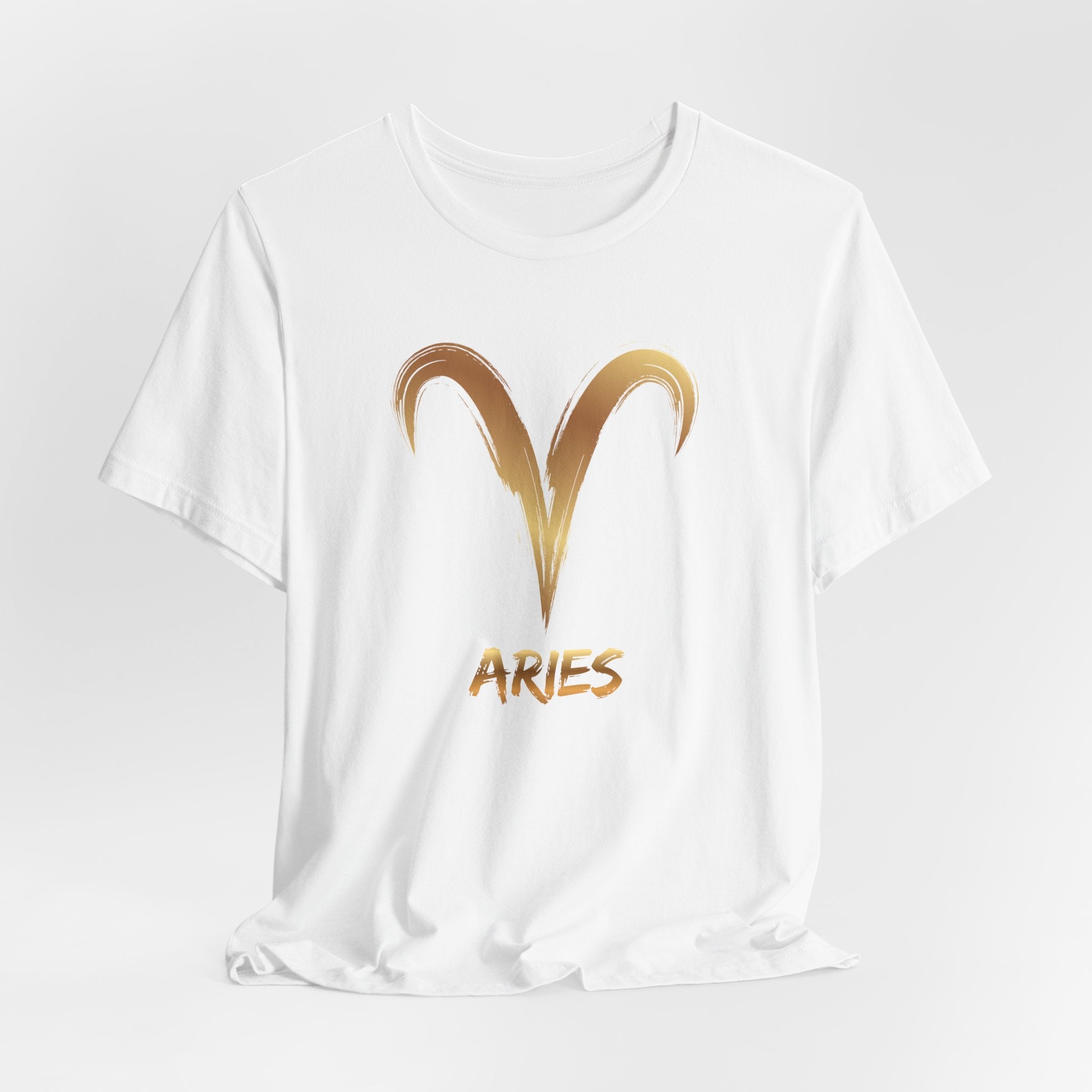 White t-shirt with gold Aries symbol and text on a white background