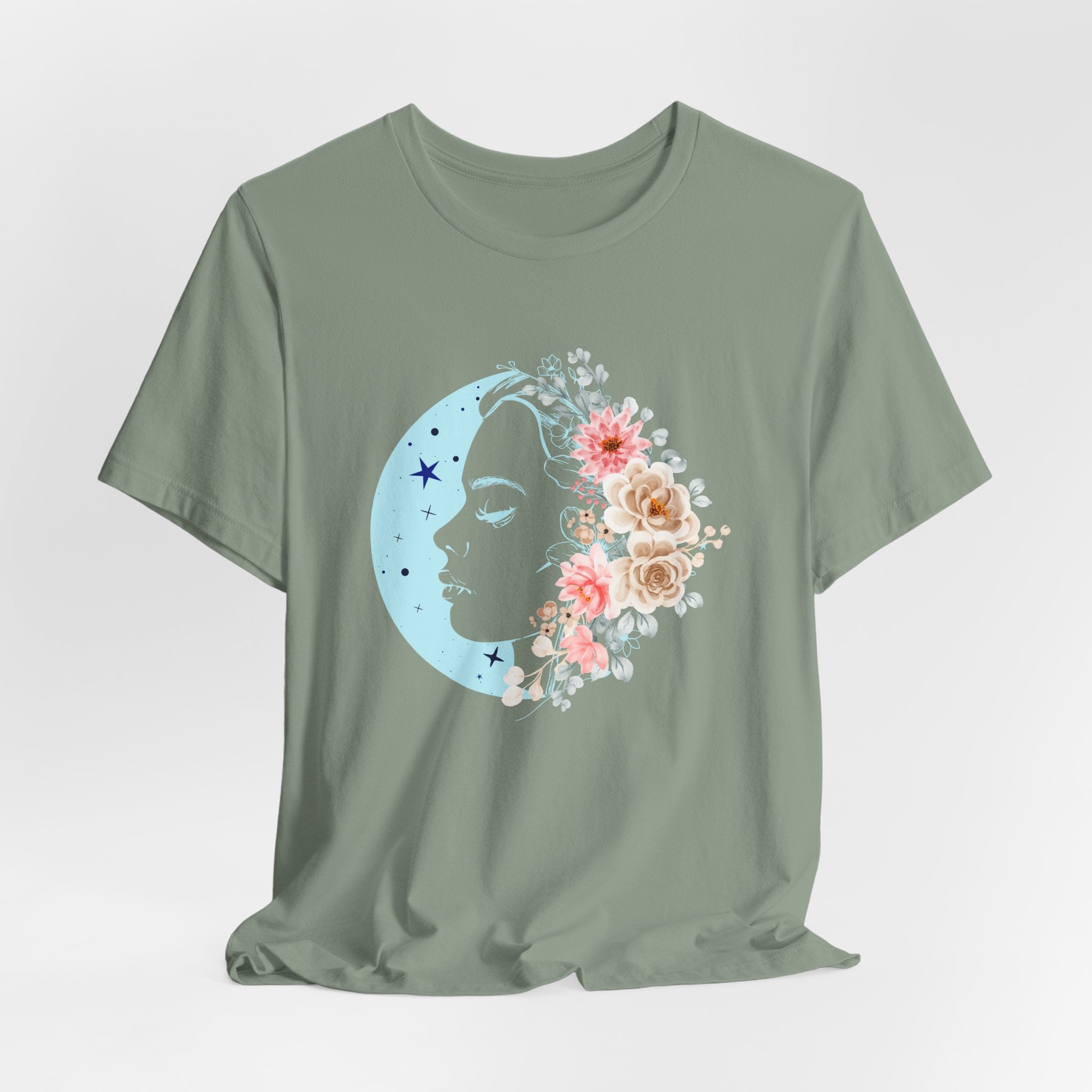 Green t-shirt with a floral and moon design on a light gray background
