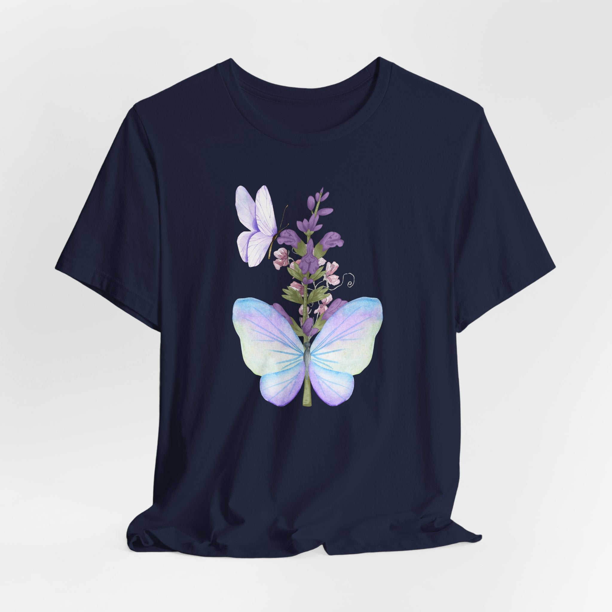 Navy blue t-shirt with butterfly and floral design on a light gray background