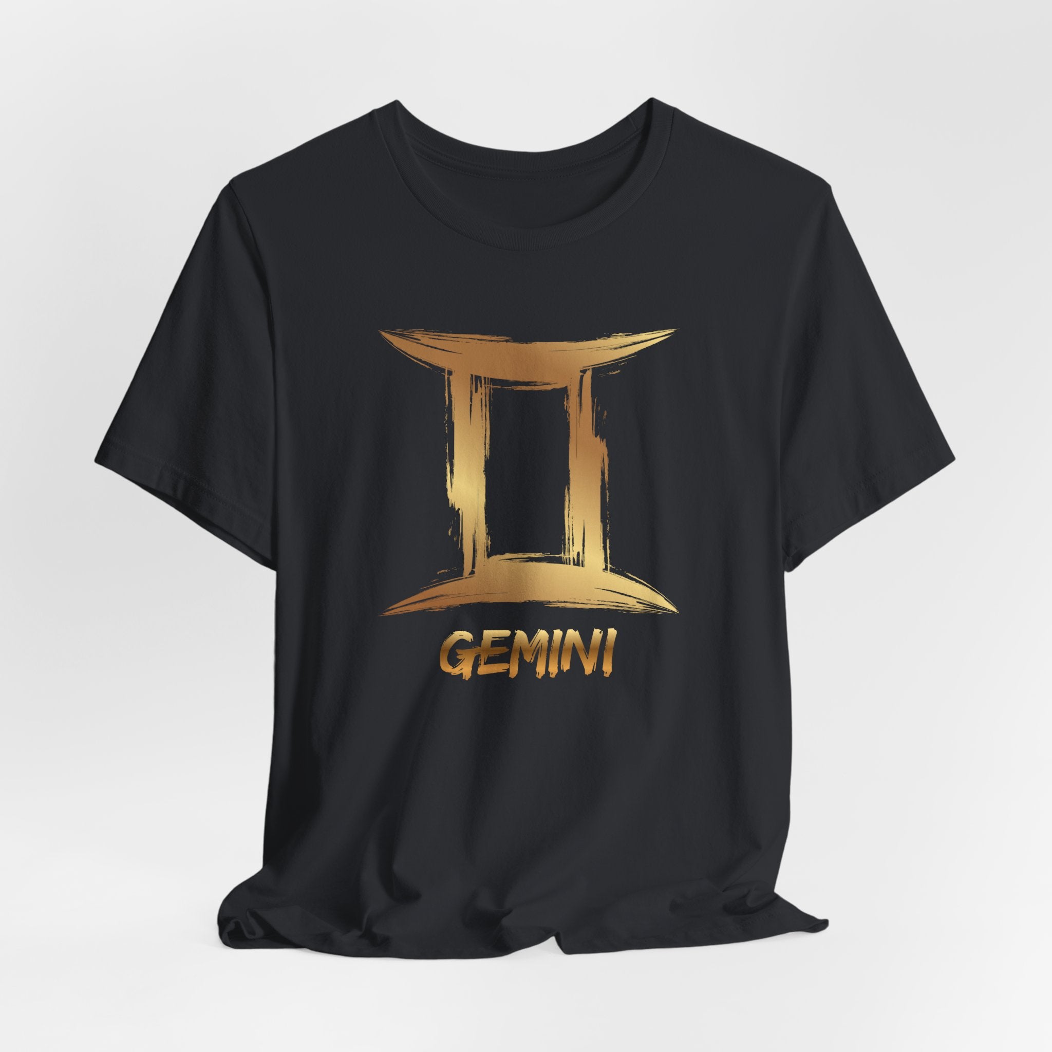 Black t-shirt with gold Gemini zodiac sign design on a white background
