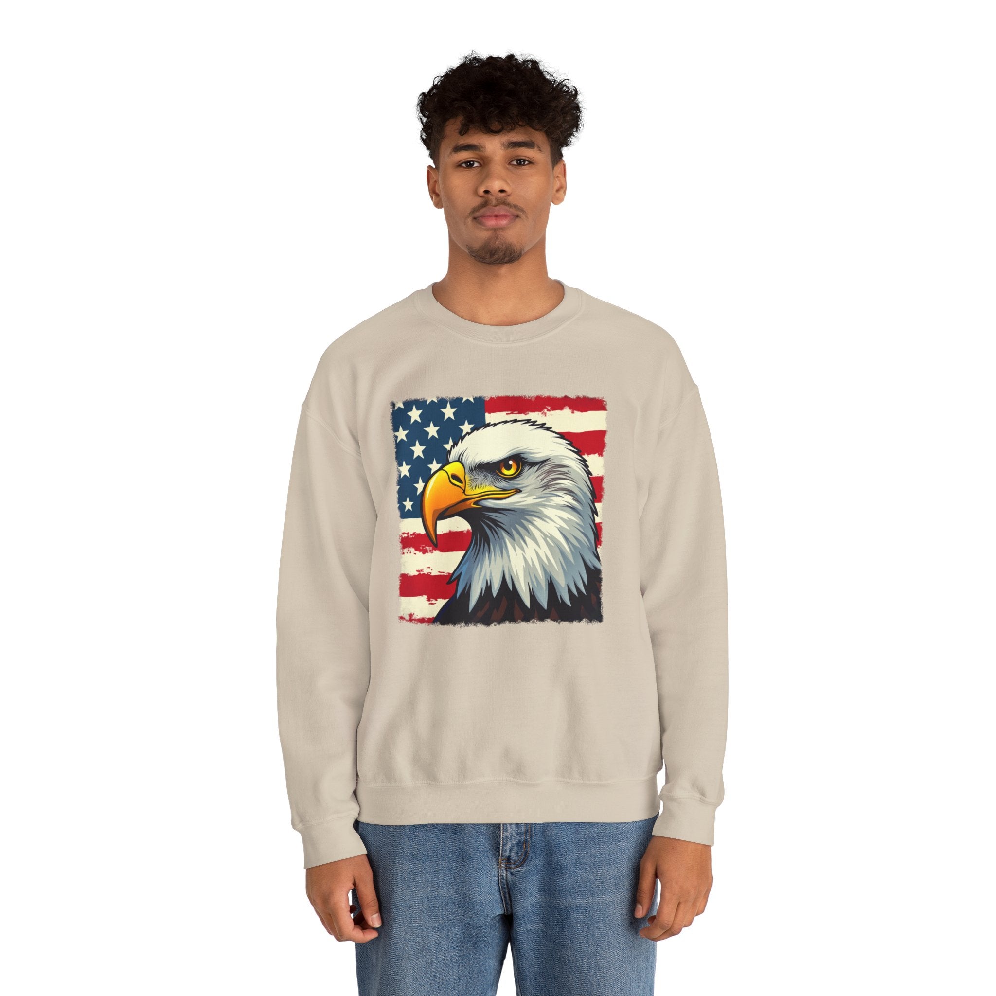 Person wearing a beige sweatshirt with an eagle and American flag design on a white background