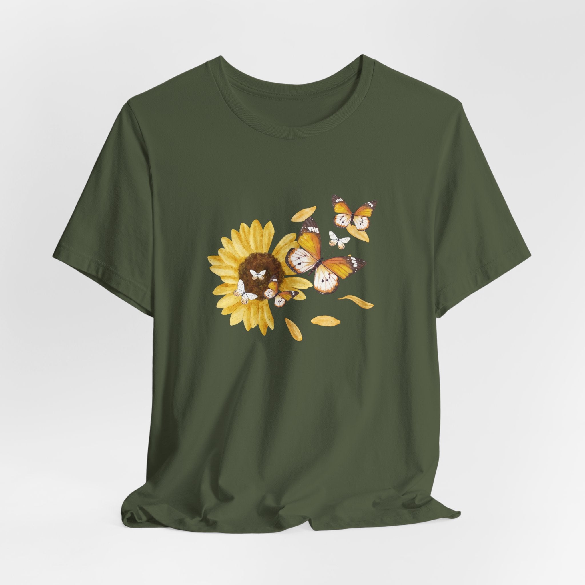 Green t-shirt with a sunflower and butterfly design on a white background