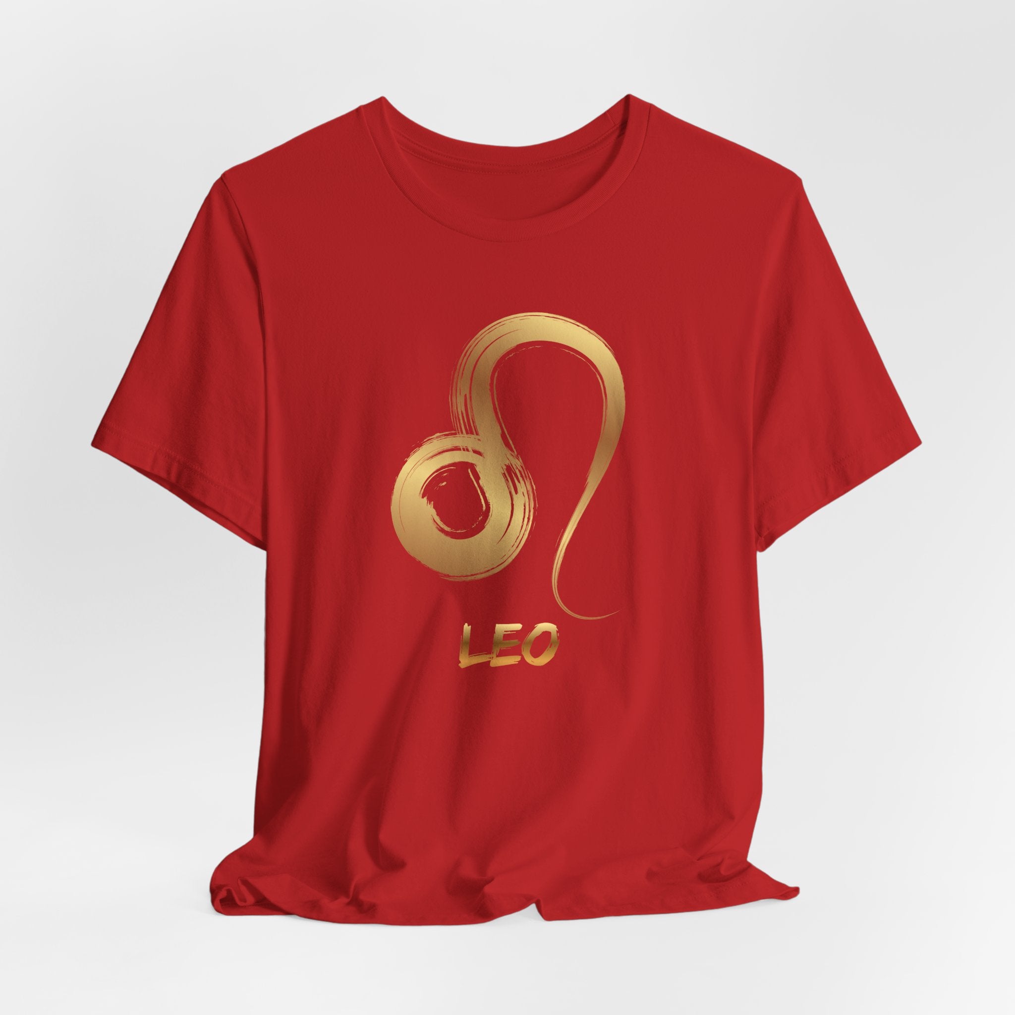 Red t-shirt with gold Leo zodiac symbol on a white background
